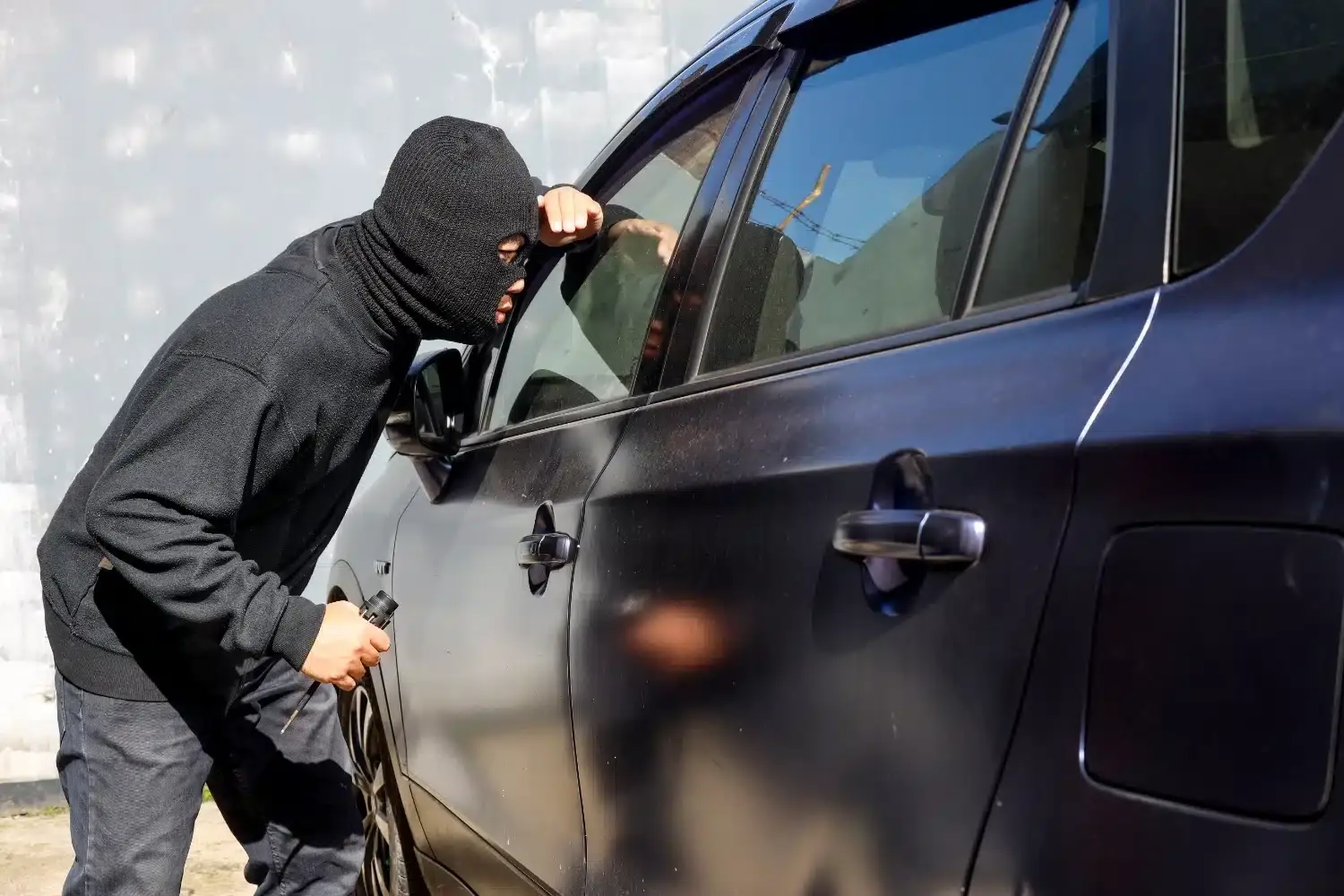 man dressed in black wearing mask hold screwdriver 2023 11 27 05 10 30 utc