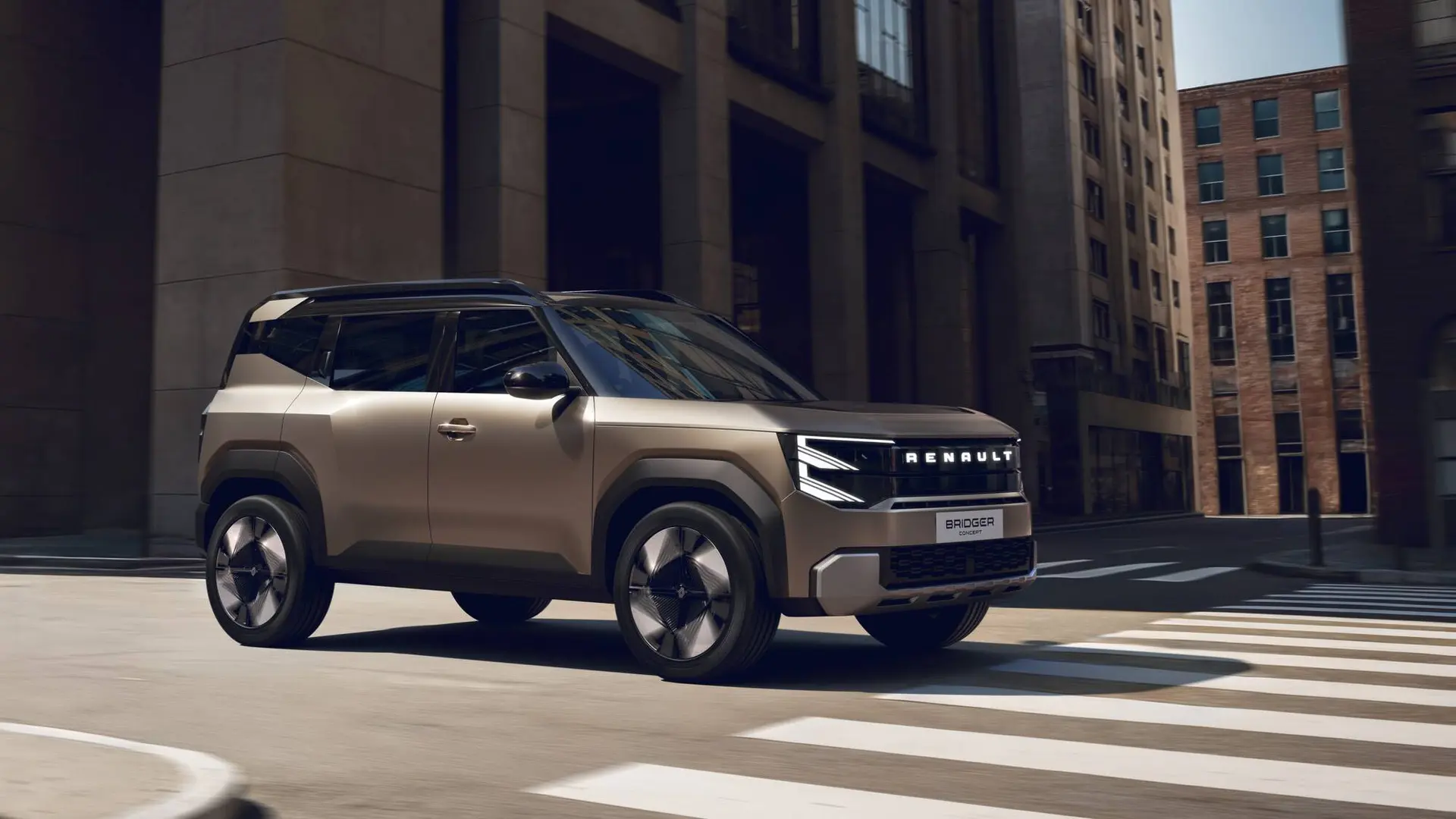 La concept della Renault Bridger di colore oro che percorre una strada