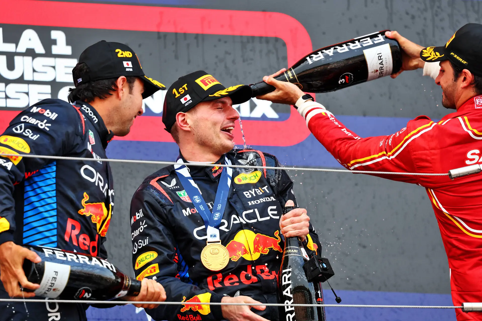 verstappen sainz and perez on the podium in japan 2024
