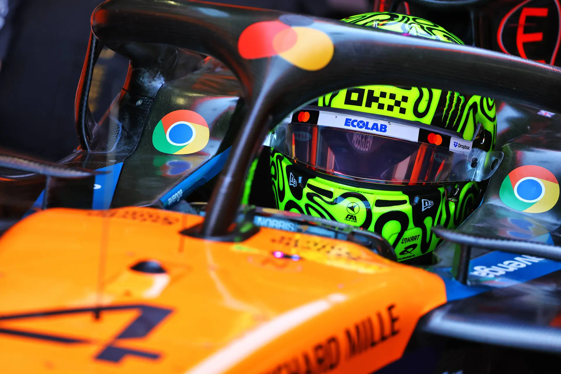 norris helmet mclaren car