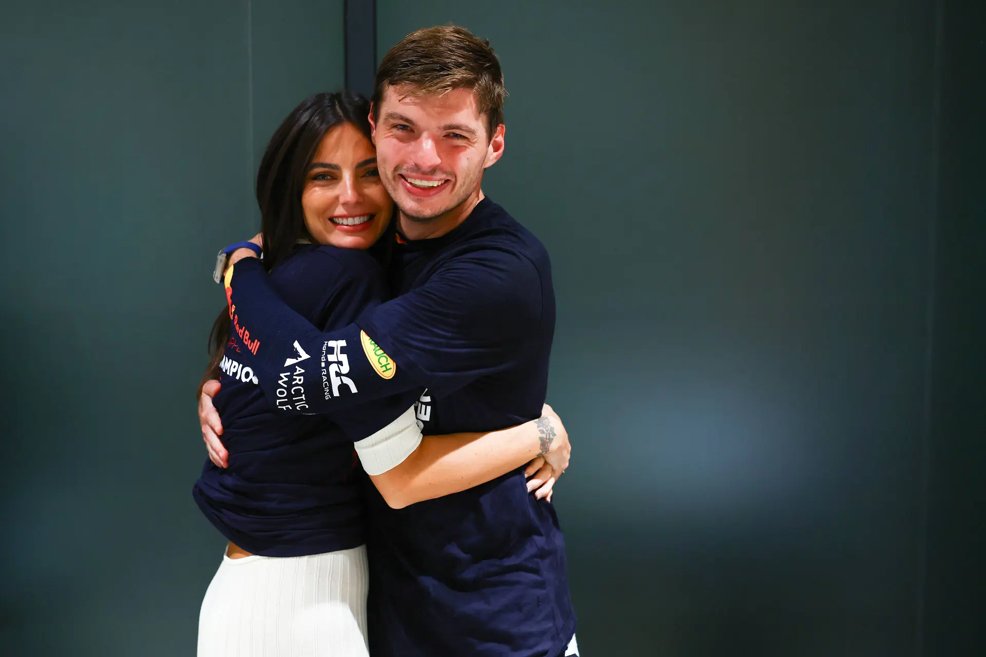Max Verstappen and his girlfriend Kelly Piquet embrace.