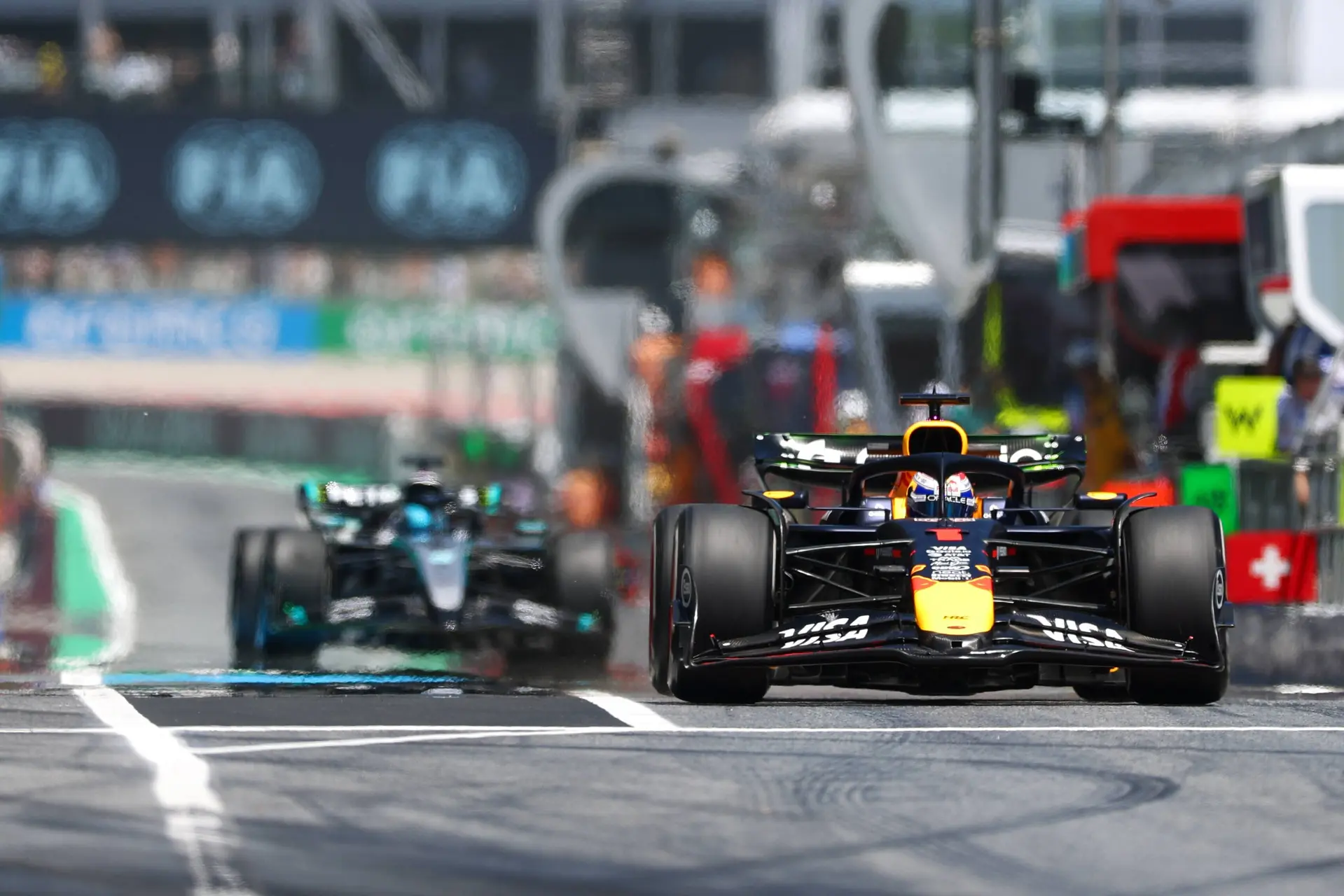 Max Verstappen, George Russell pit lane Barcelona