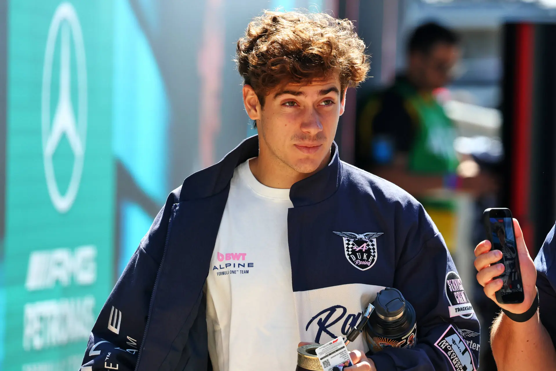 Alpine driver Franco Colapinto enters the paddock