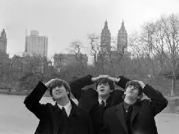 the beatles pose for photographs in central park new york