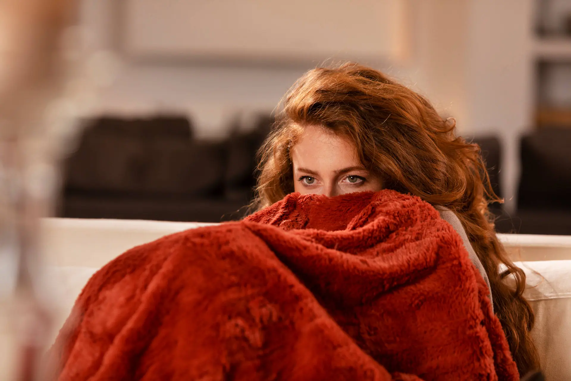 close-up-woman-covering-herself-with-blanket (1)