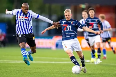 eindhoven 18 04 2025 jan louwers stadium dutch keukenkampioendivisie football season 2024 2025 fc eindhoven telstar telstar player guus offerhaus and fc eindhoven player rangelo janga during the match fc eindhoven telstar