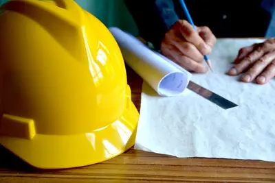architect man working with blueprints engineer inspection in workplace for architectural plan