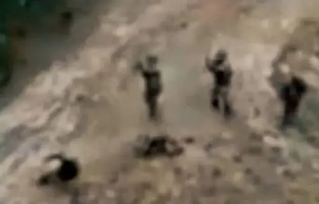 troops-tell-body-pits-unarmed-1061781627
