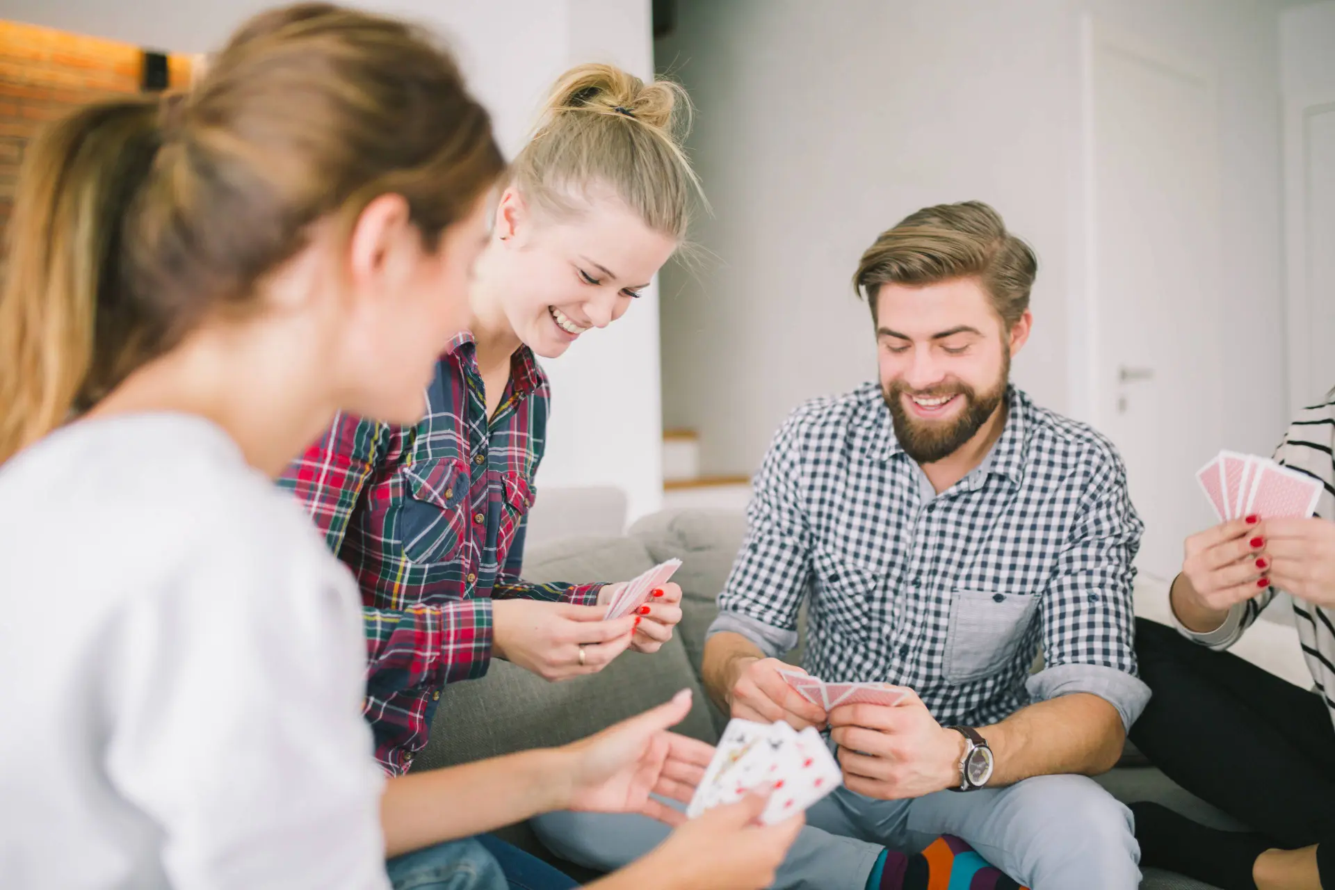delighted-friends-enjoying-card-game