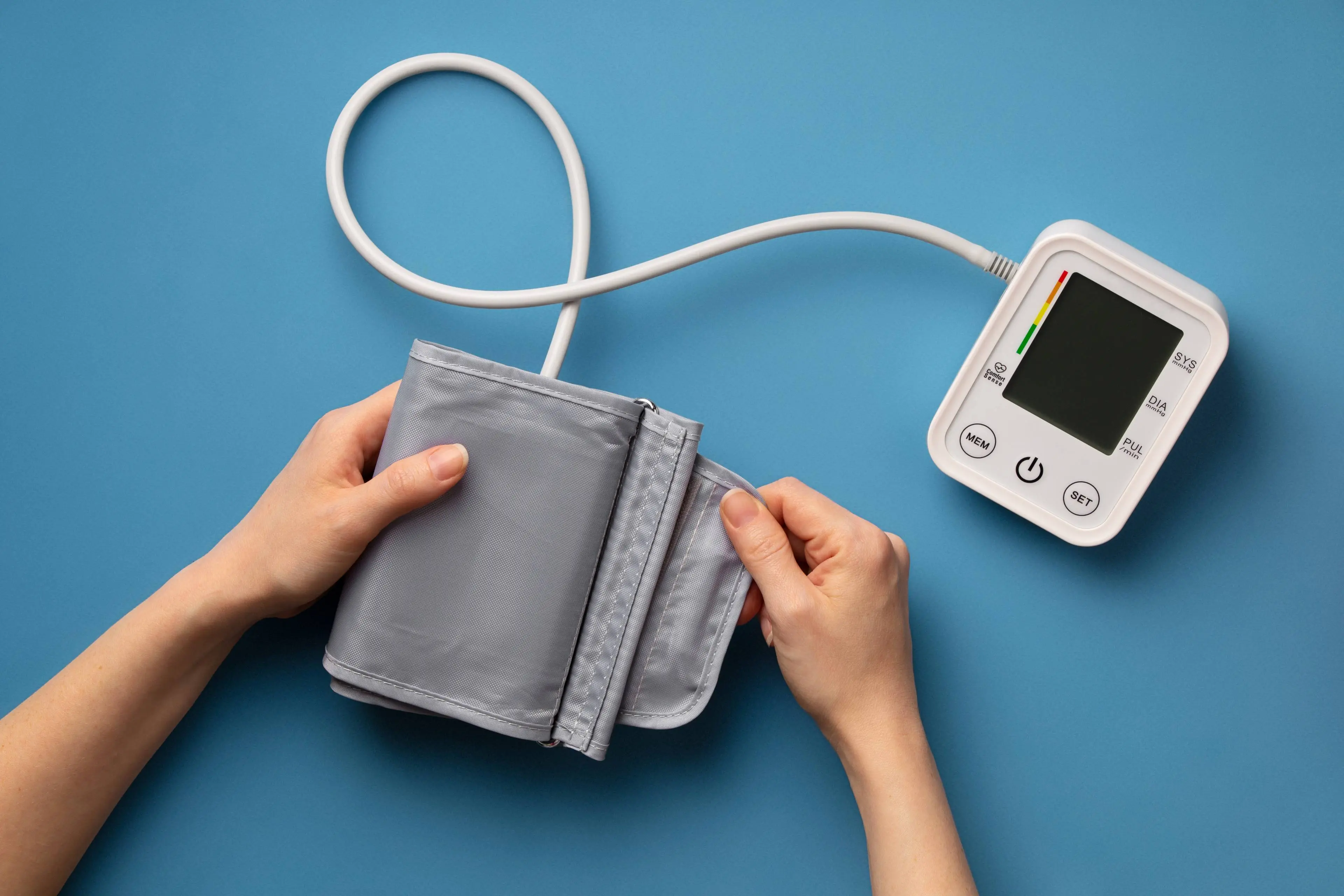 person-using-tensiometer-blood-pressure