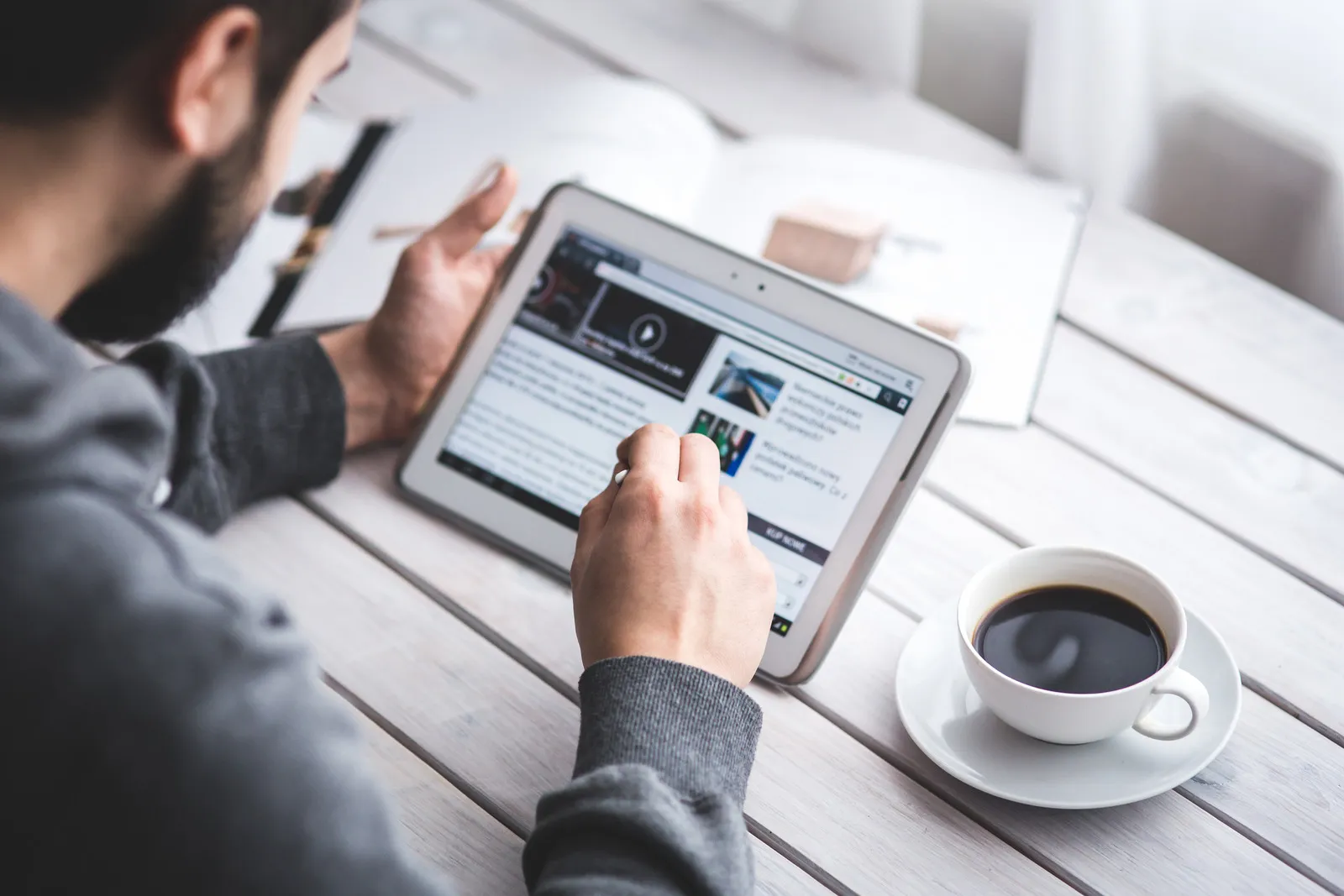 canva man using stylus pen for touching the digital tablet screen