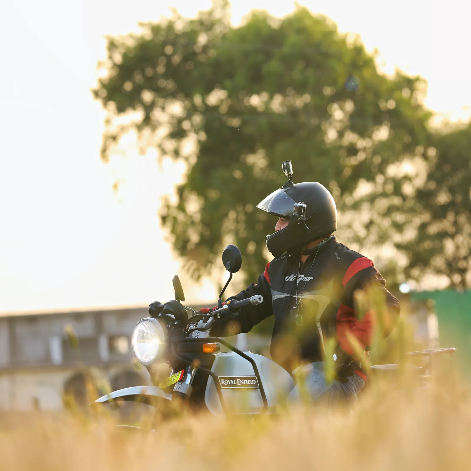 canva motorcyclist sitting on gray motorcycle outdoors