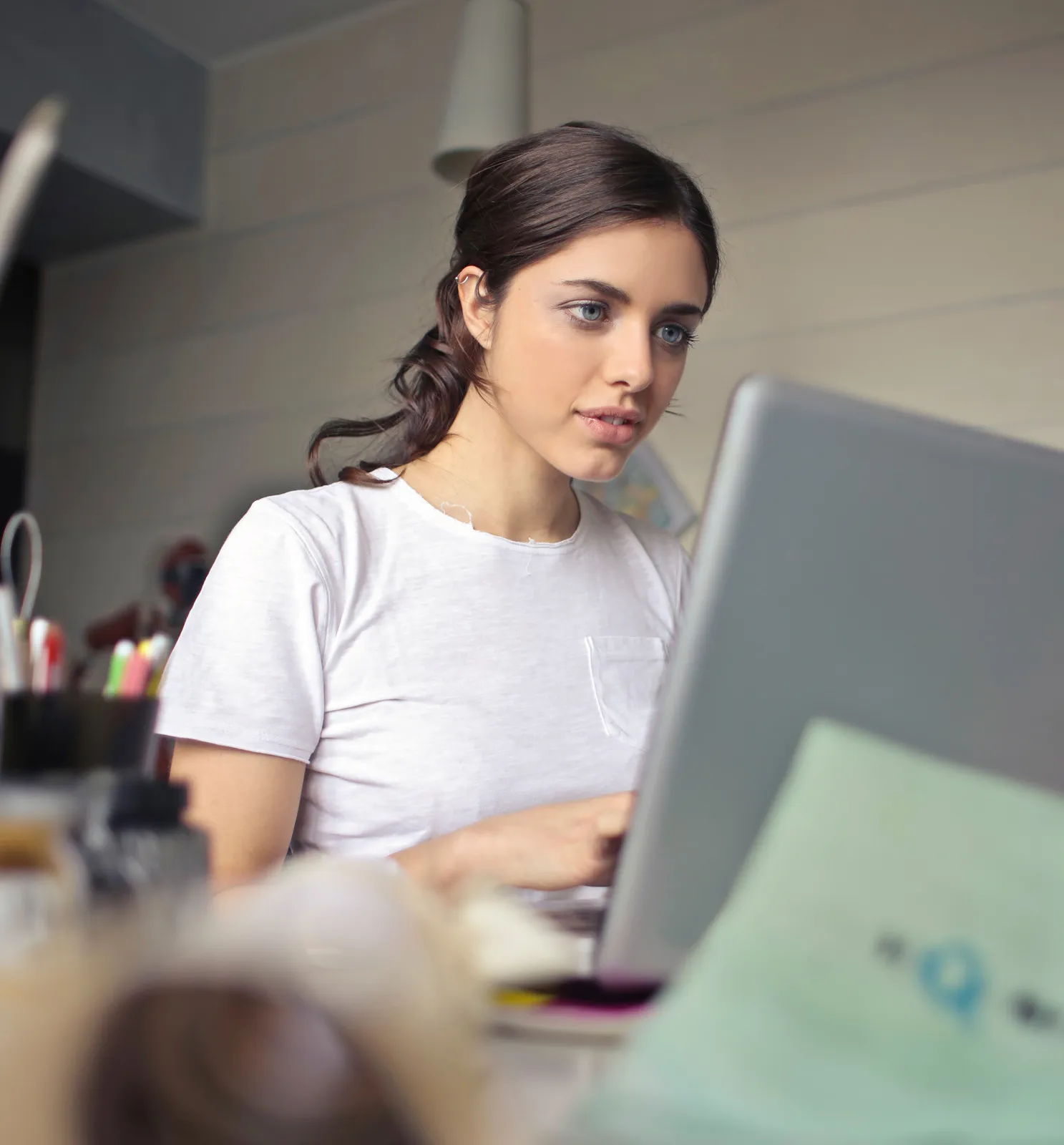 canva photography of a woman using laptop