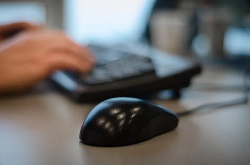 canva selective focus photography of black mouse on desk 3
