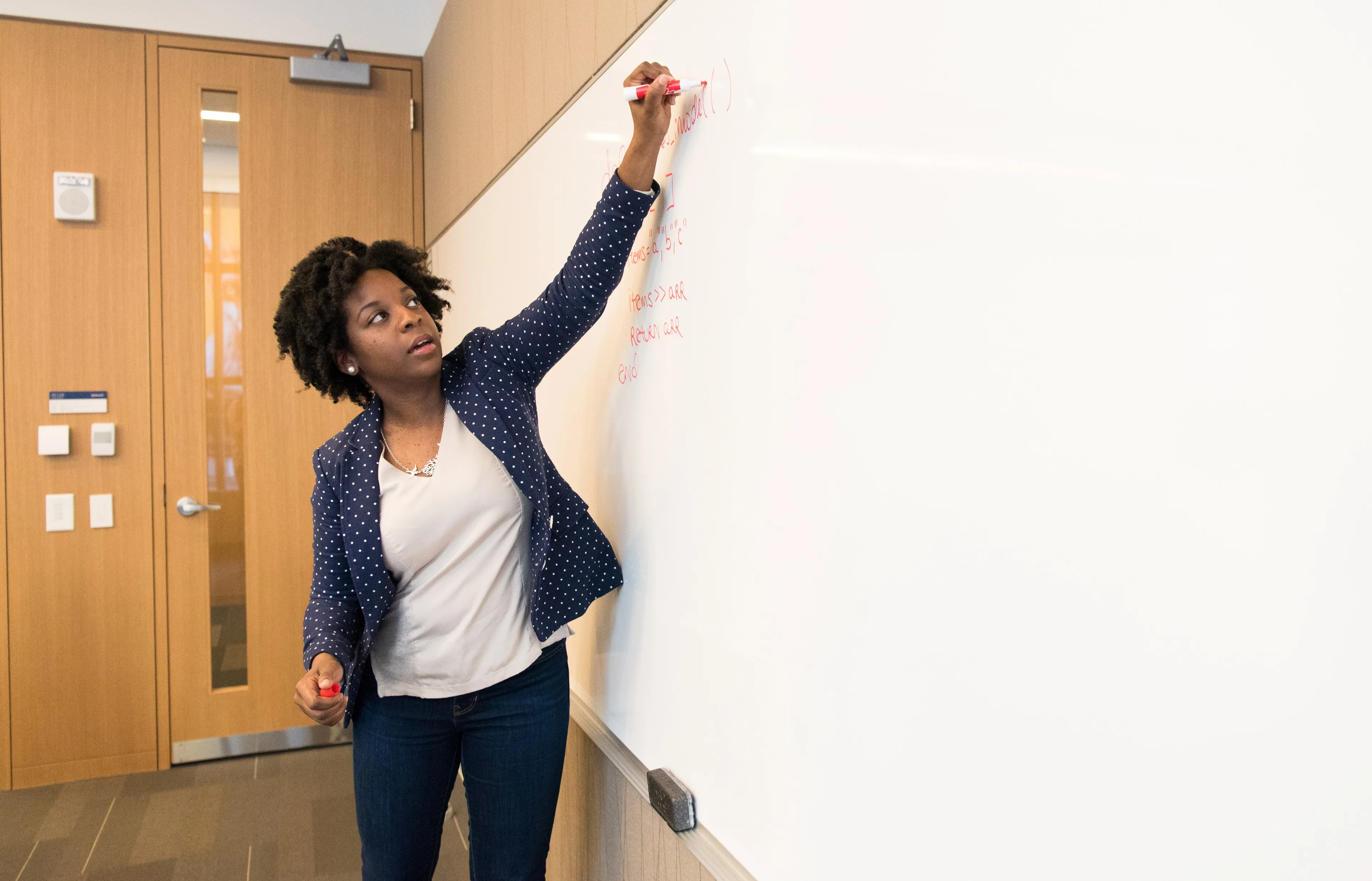 canva woman writing on dry erase board 2
