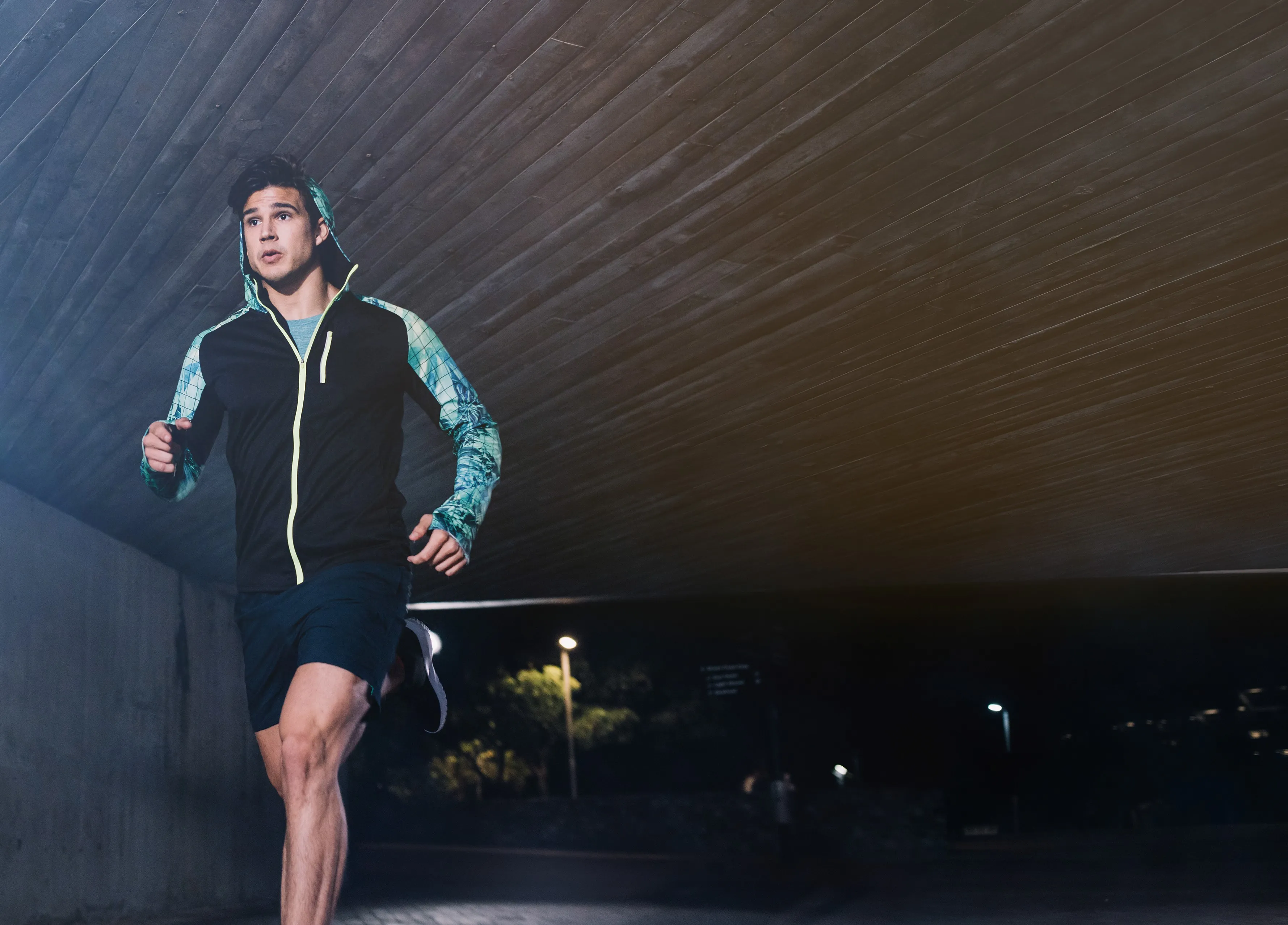 canva young man jogging at night in city 2