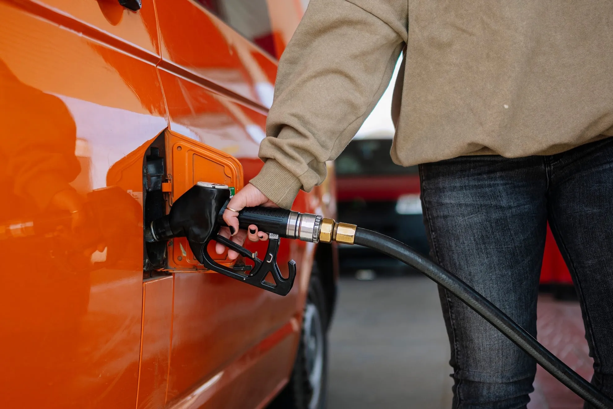 woman s hand filling the tank of her vehicle with 2022 04 08 02 02 03 utc
