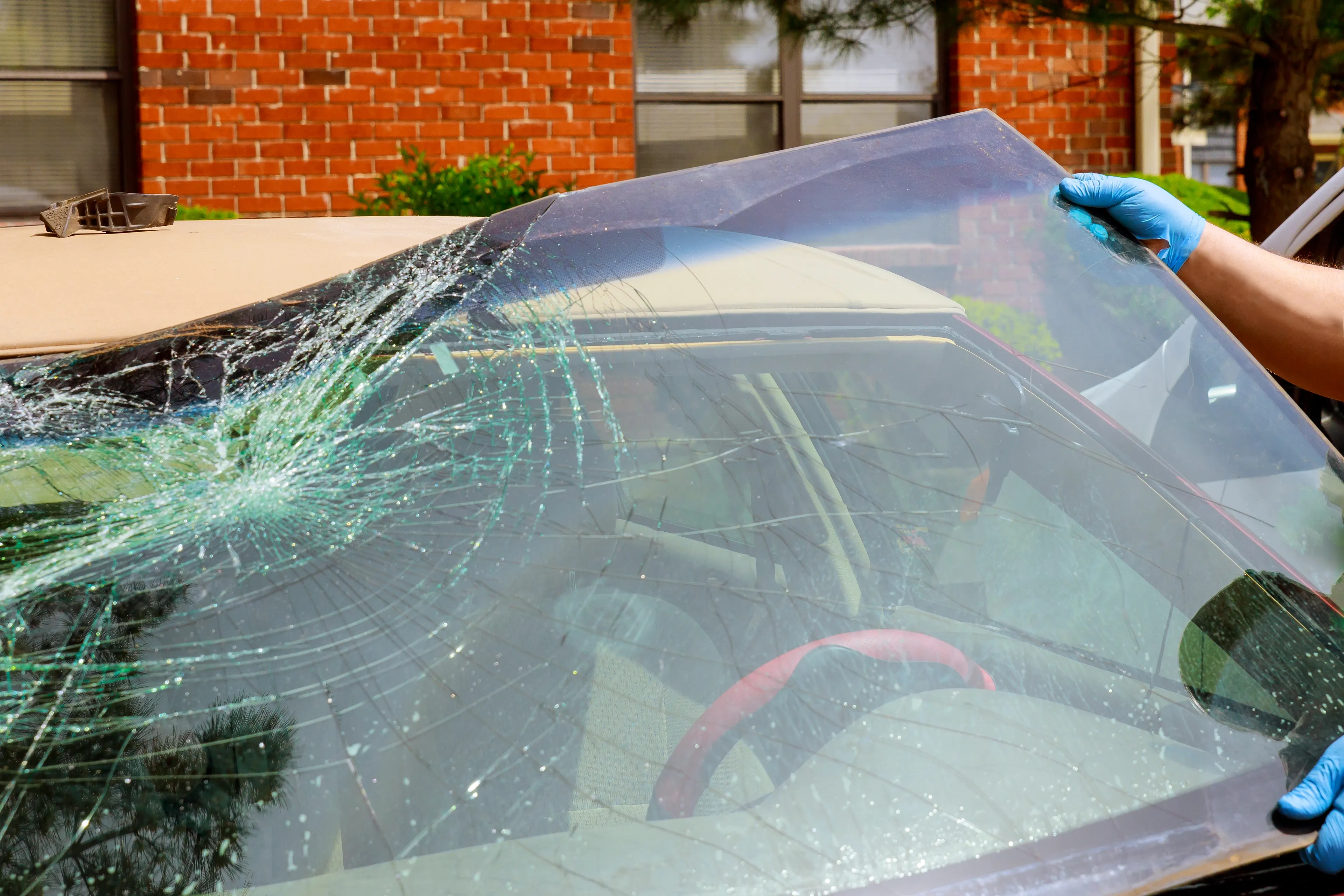 workers remove crashed windshield of a car in auto 2021 08 30 22 09 30 utc