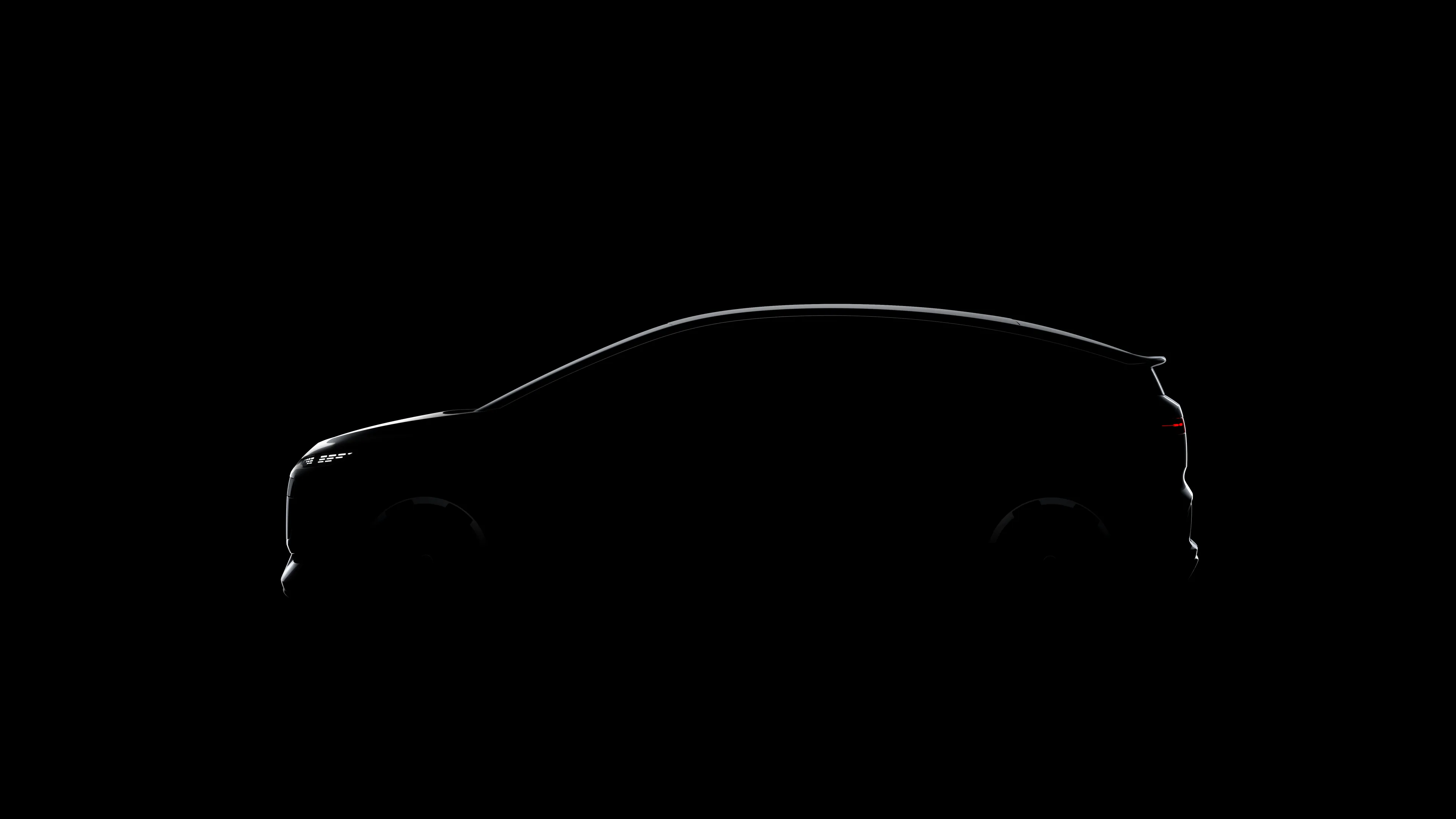 teaser della nuova Audi 2 e-tron, immagine in cui si vede solo la silhouette della vettura si vedono i bordi dell'auto