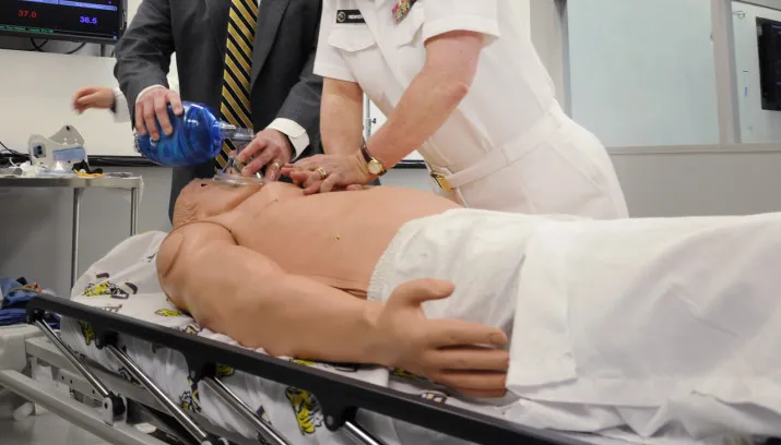 flickr official us navy imagery ear adm elizabeth niemyer performs cpr on a medical dummy1 e1436425455302 715x408