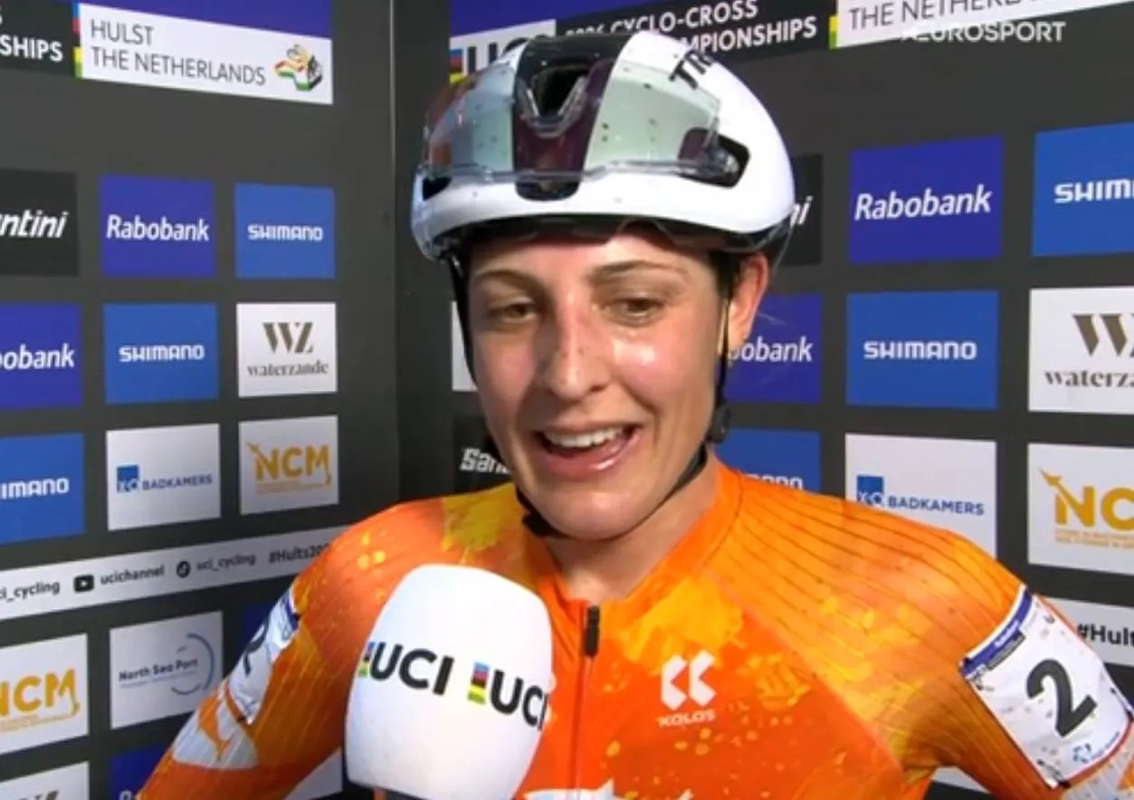 Lucinda Brand talking to the microphone after winning the 2026 cyclocross world championships