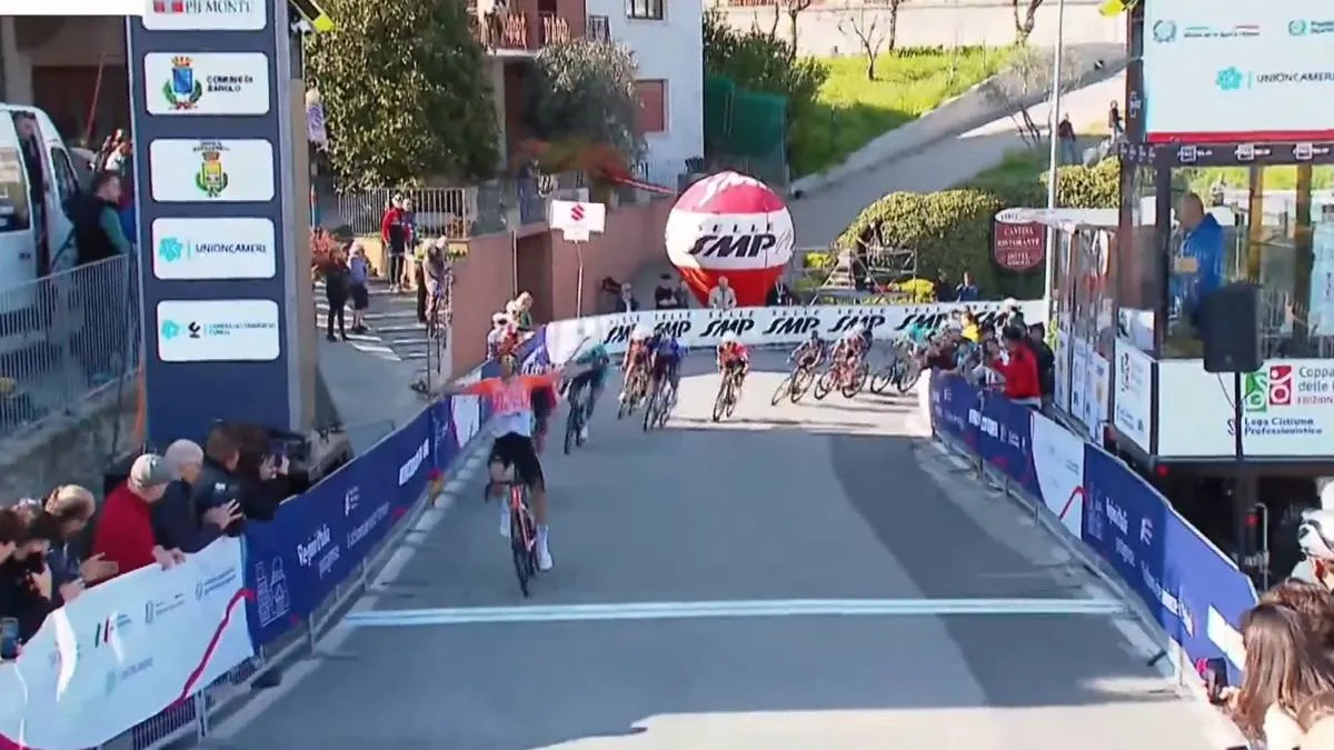 Axel Laurance celebrates his win on stage 1 of the 2026 Coppi e Bartali
