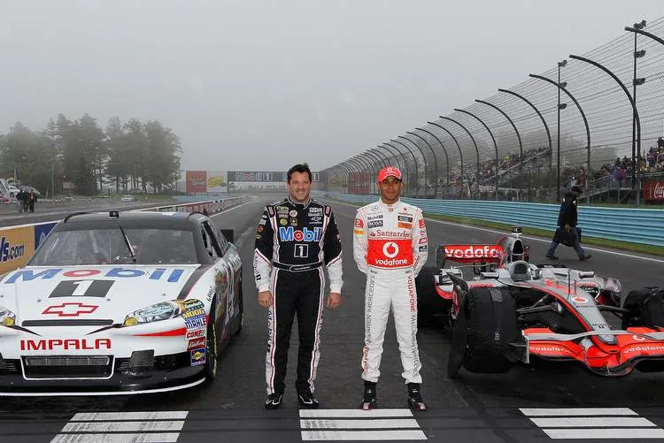 116056061 f1 driver lewis hamilton and nascar driver tony stewart car swapjpg