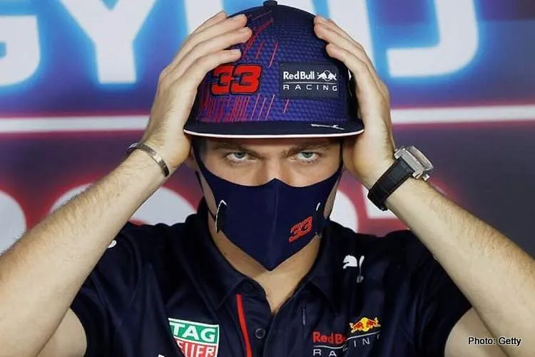 max verstappen listening to tom clarko clarkson during hungarian grand prix press conference