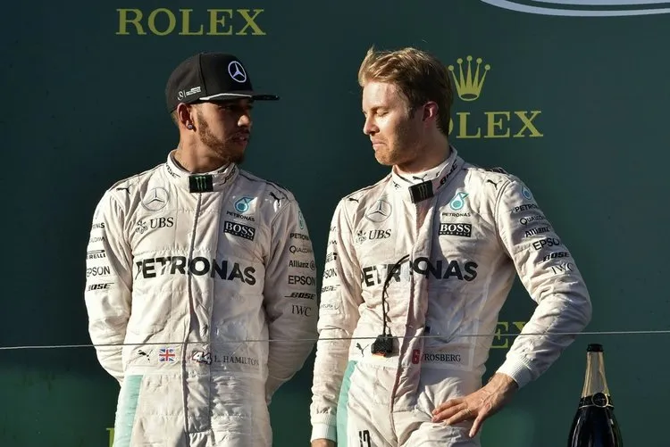 mercedes amg petronas f1 teams german driver nico rosberg r talks to his teammate british driver lewis hamilton3