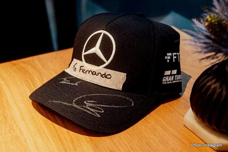 to fernando alonso from lewis hamilton cap after belgian gp crash