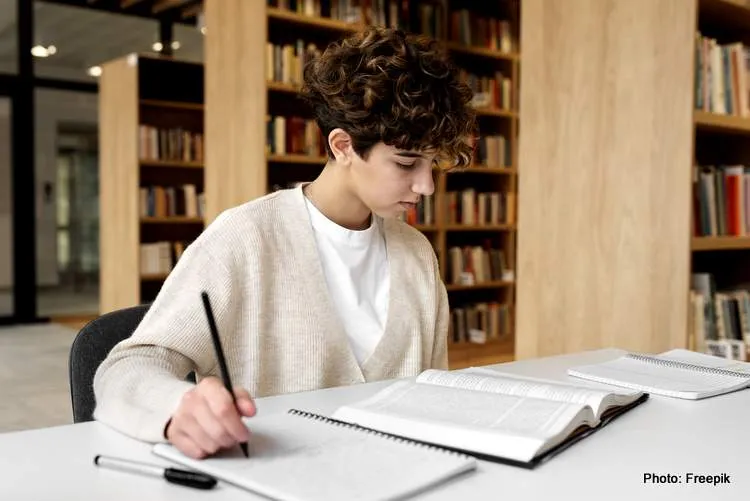 young student learning library study