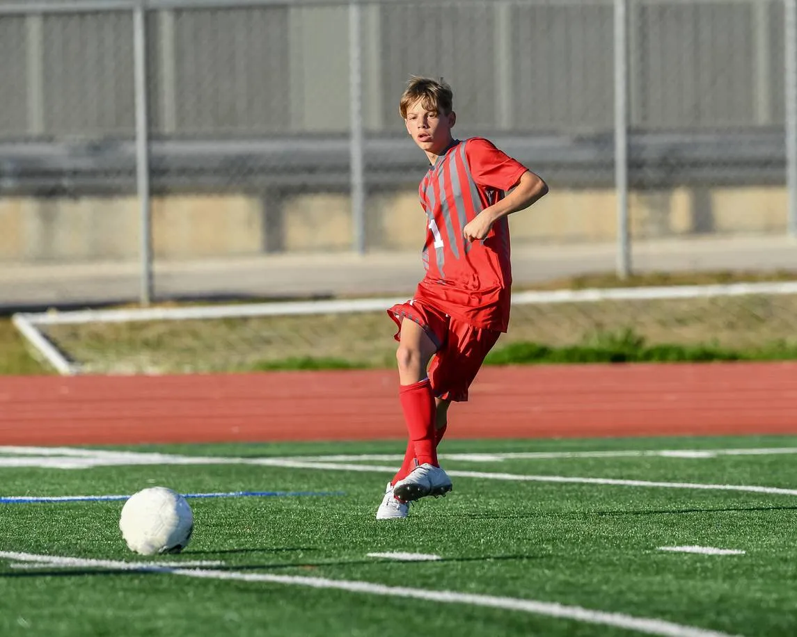 high school boy athlete making amazing plays during a soccer game 1132826201 1147x918