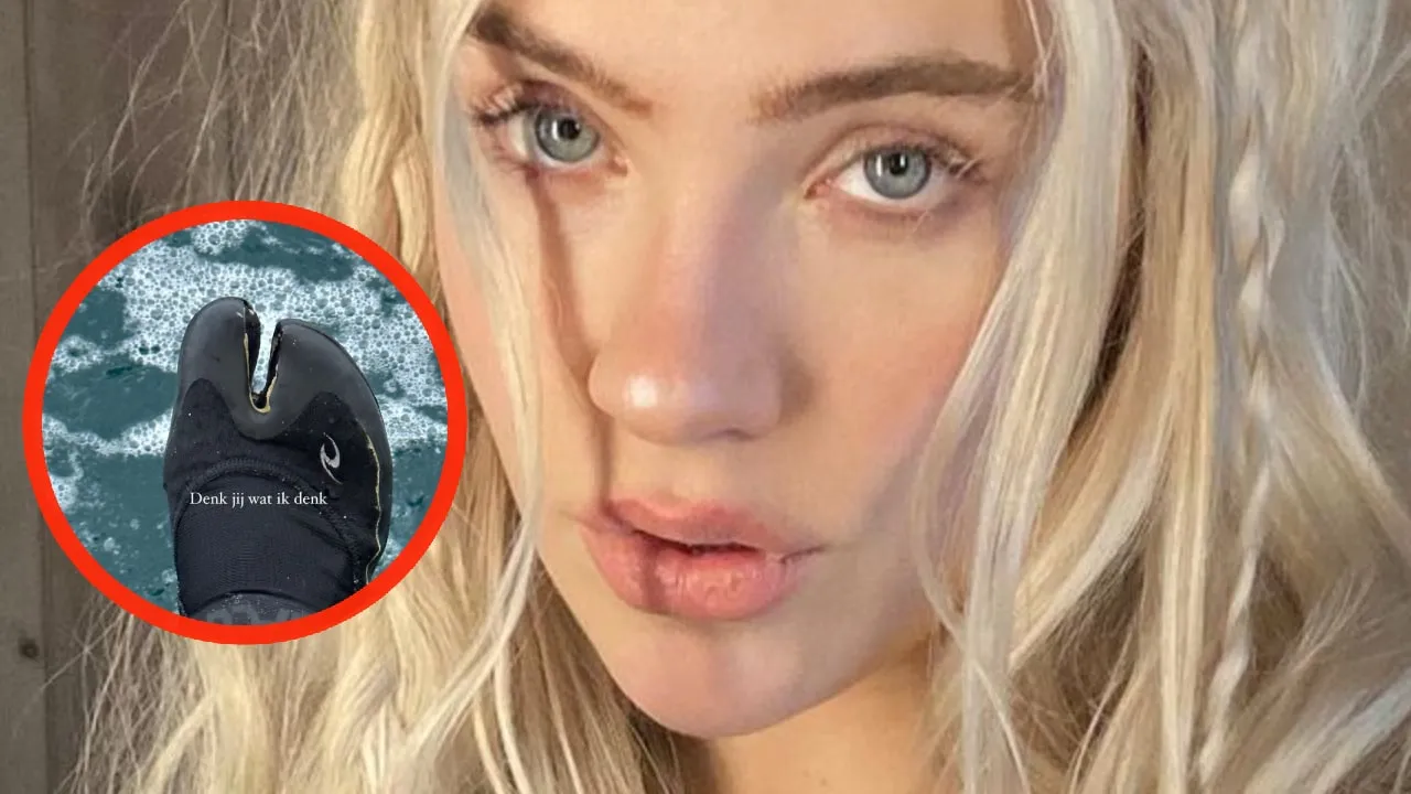 foto juultje tieleman lacht om haar enorme kamelenteen in wetsuit