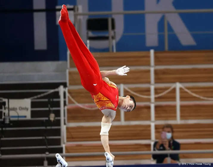 chinese turner zou pakt olympische titel op brug