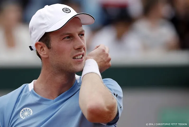 van de zandschulp na maatregel met ander gevoel naar wimbledon