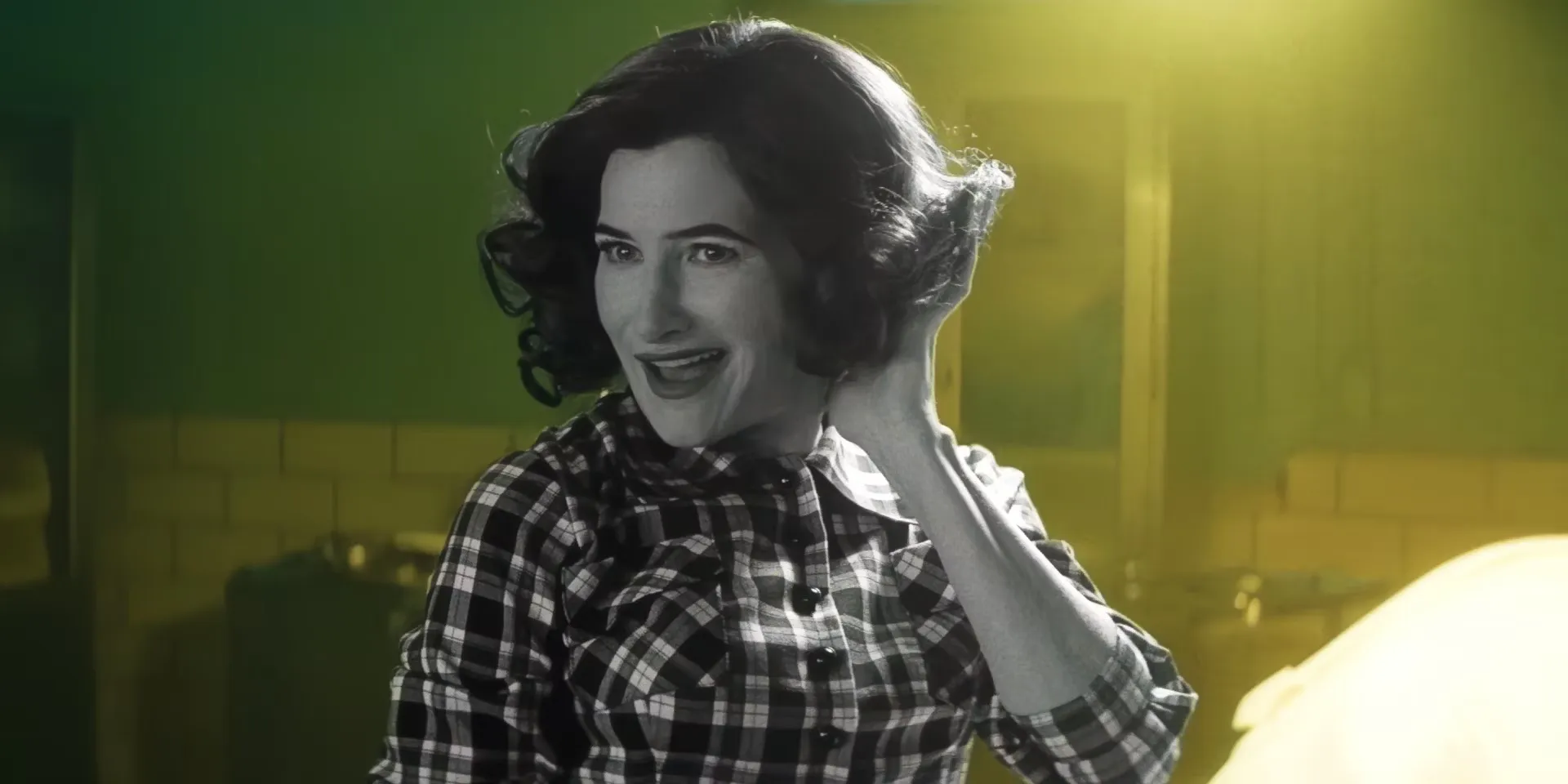 kathryn hahn as agatha harkness as agnes in black white against a colorful background in agatha all along trailer