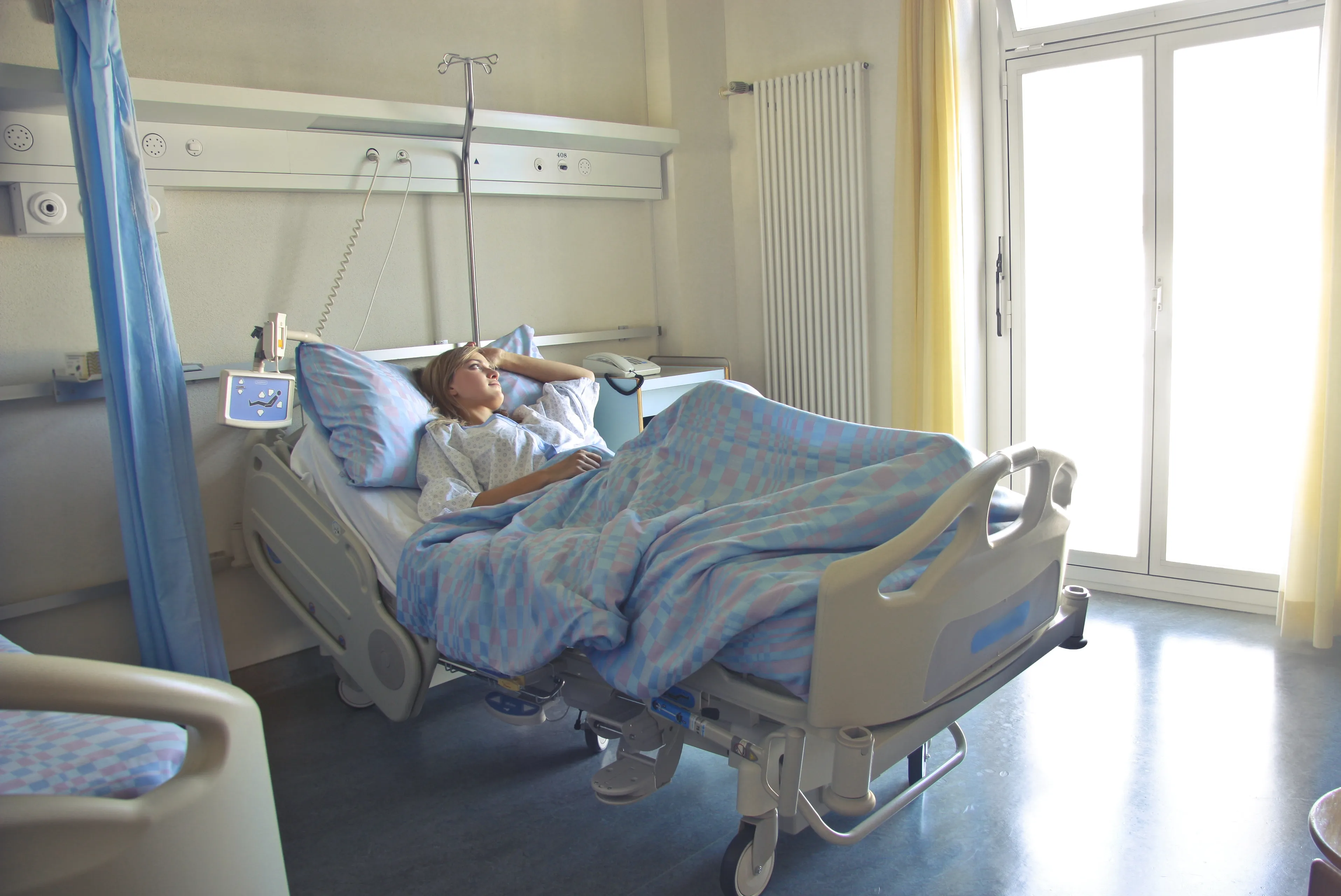 photo of woman lying in hospital bed 3769151