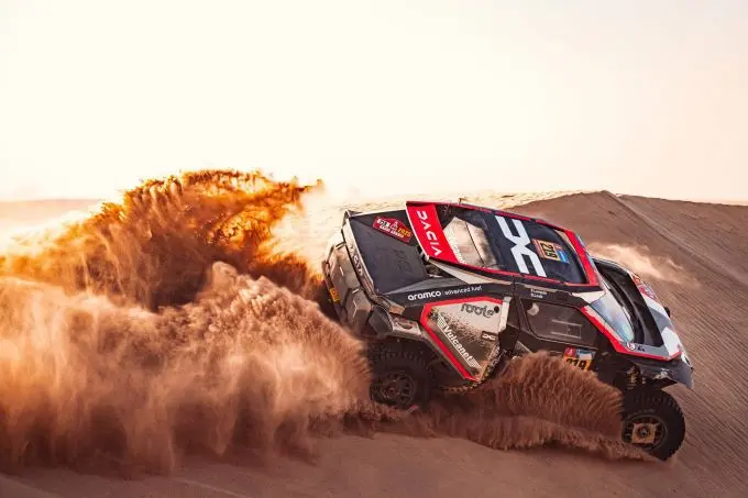 dacia 2 sandriders in the dakar rally podium fight