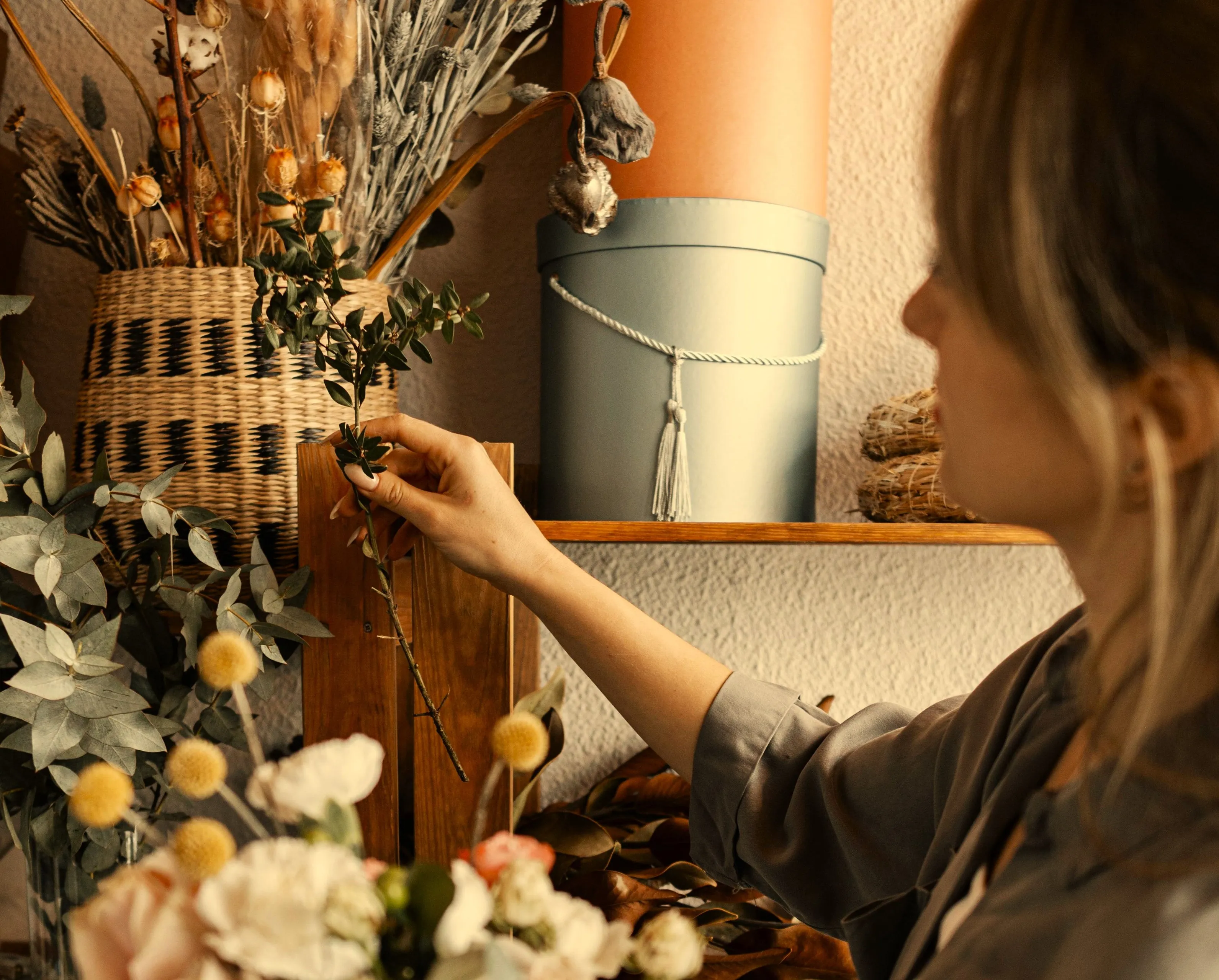 woman making beautiful floral arrangement