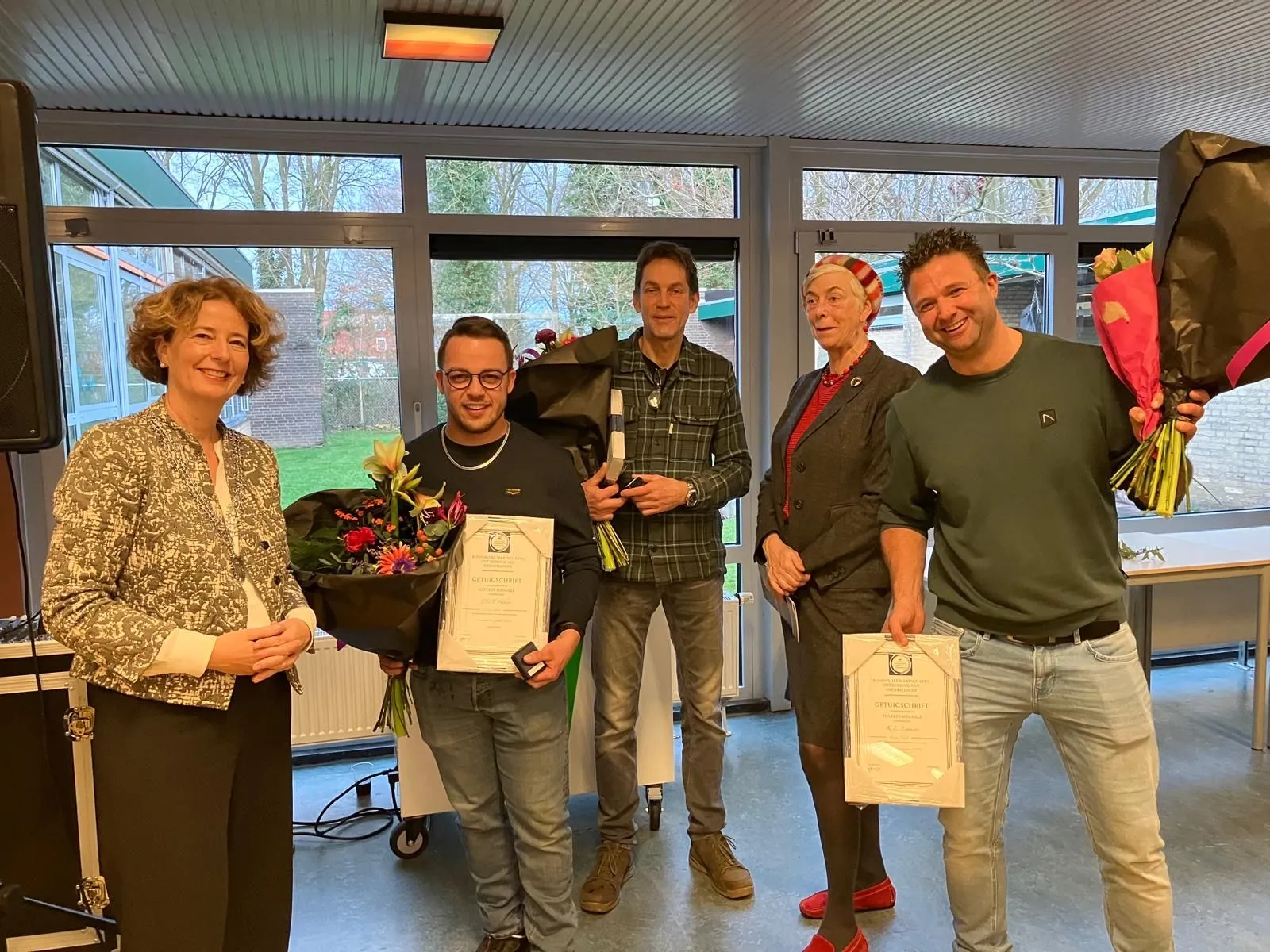 uitreiking zilveren medaille