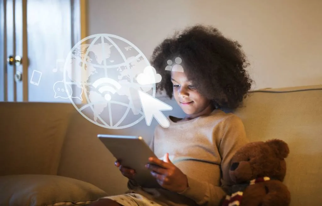 young black girl using digital tablet
