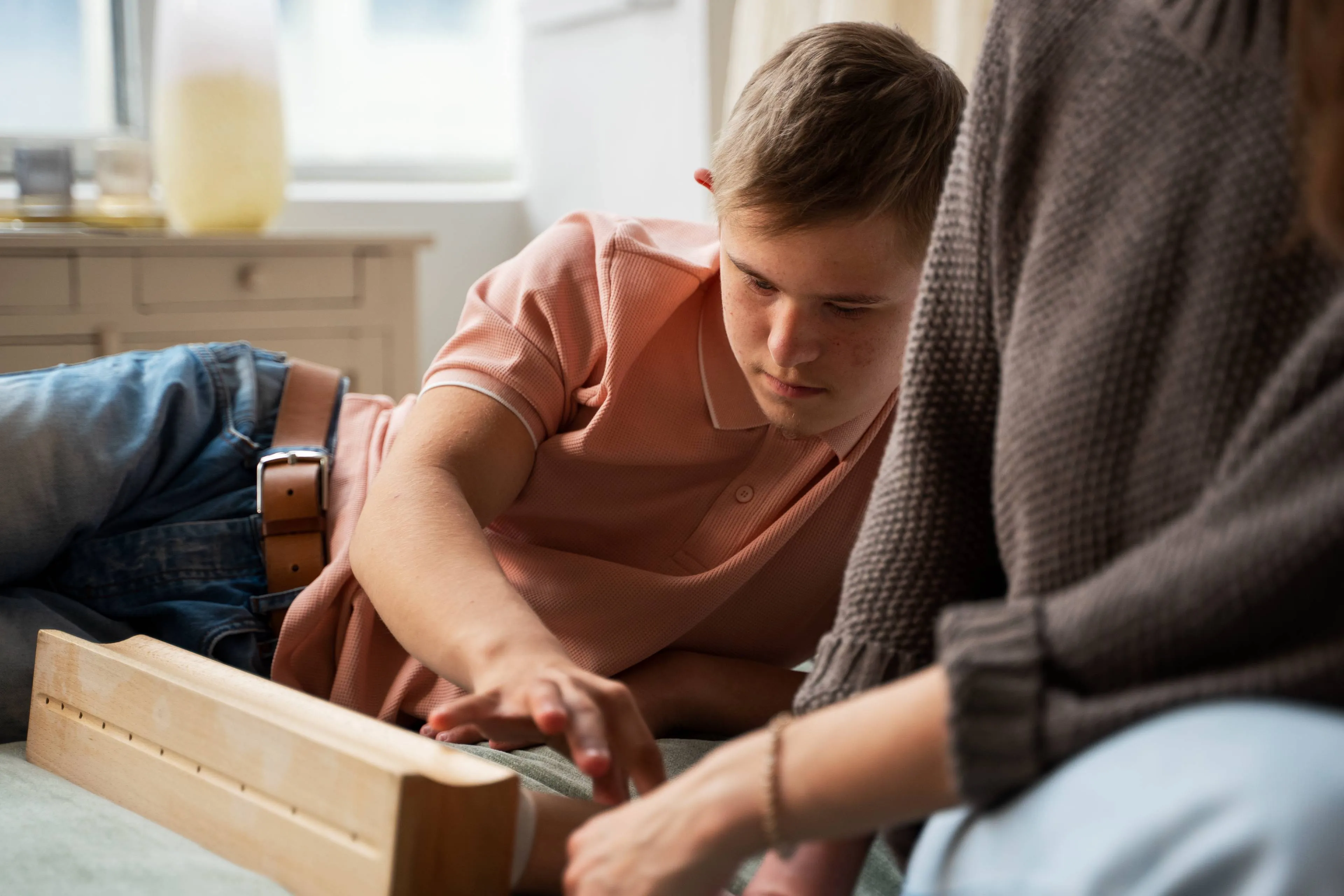 side-view-boy-playing-with-wooden-toy