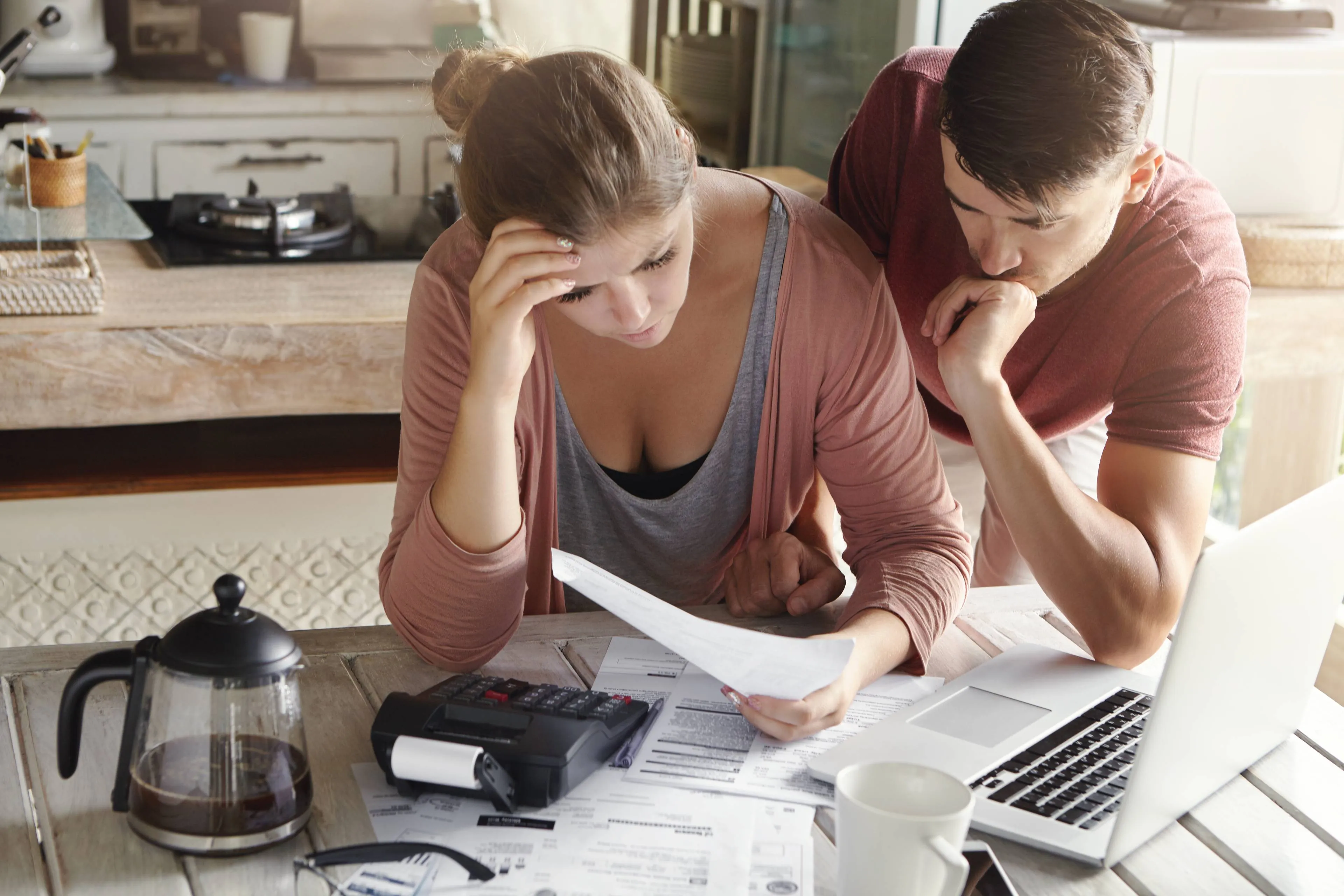 worried-couple-reviewing-their-family-finances-calculating-expenses (1)