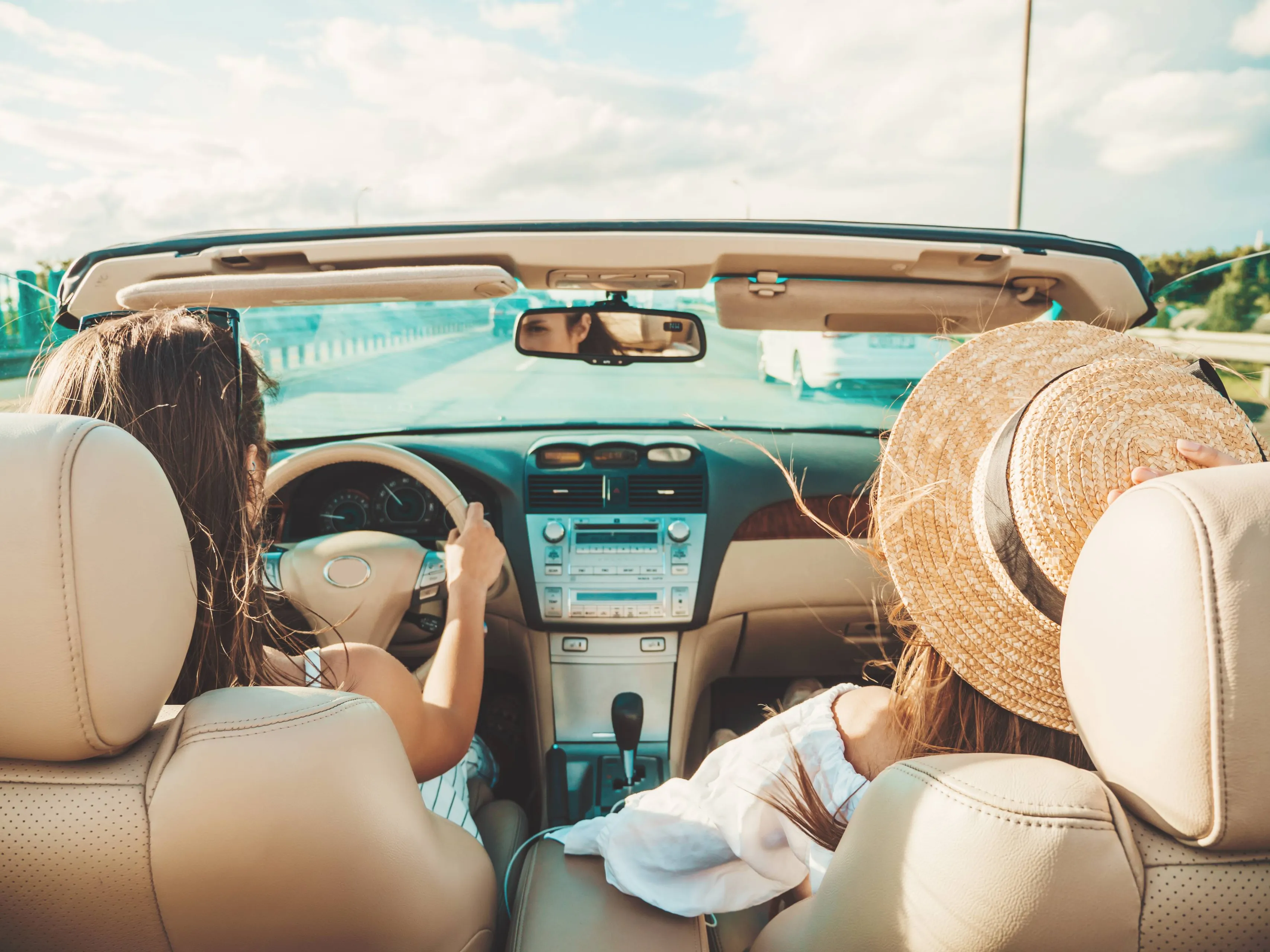 portrait-two-young-beautiful-smiling-hipster-female-convertible-car
