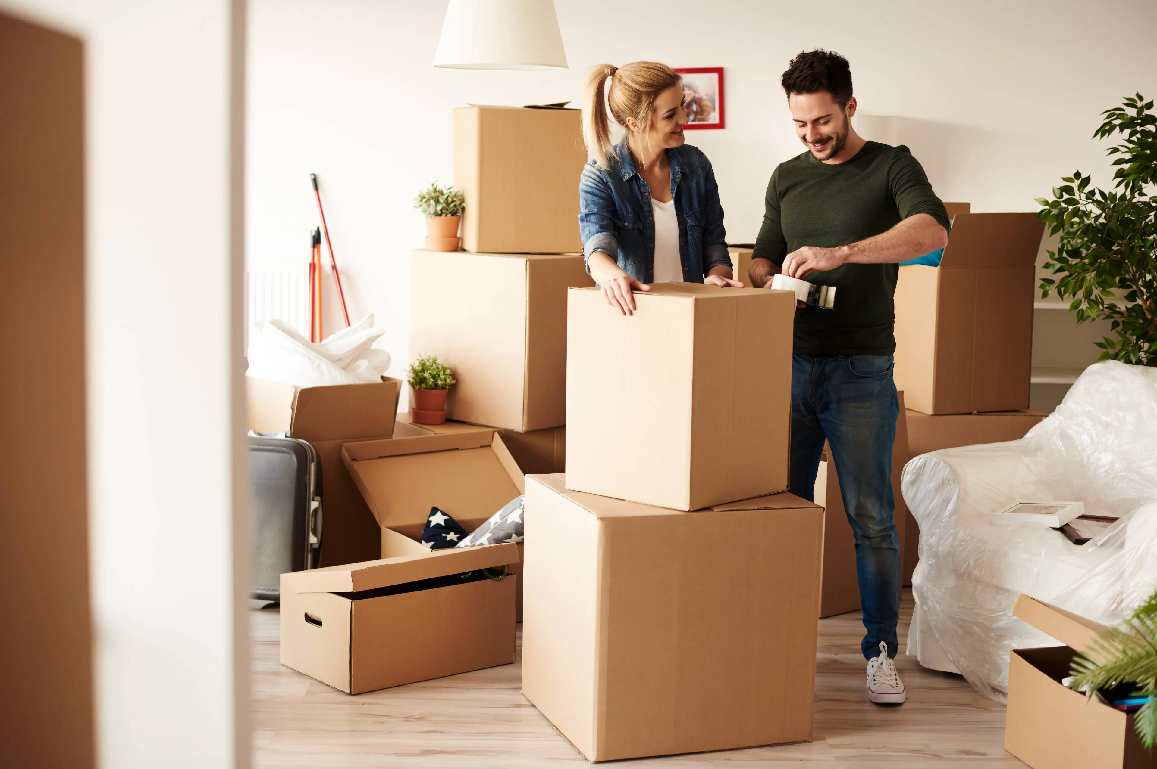 couple-packing-stuff-plenty-cardboard-boxes