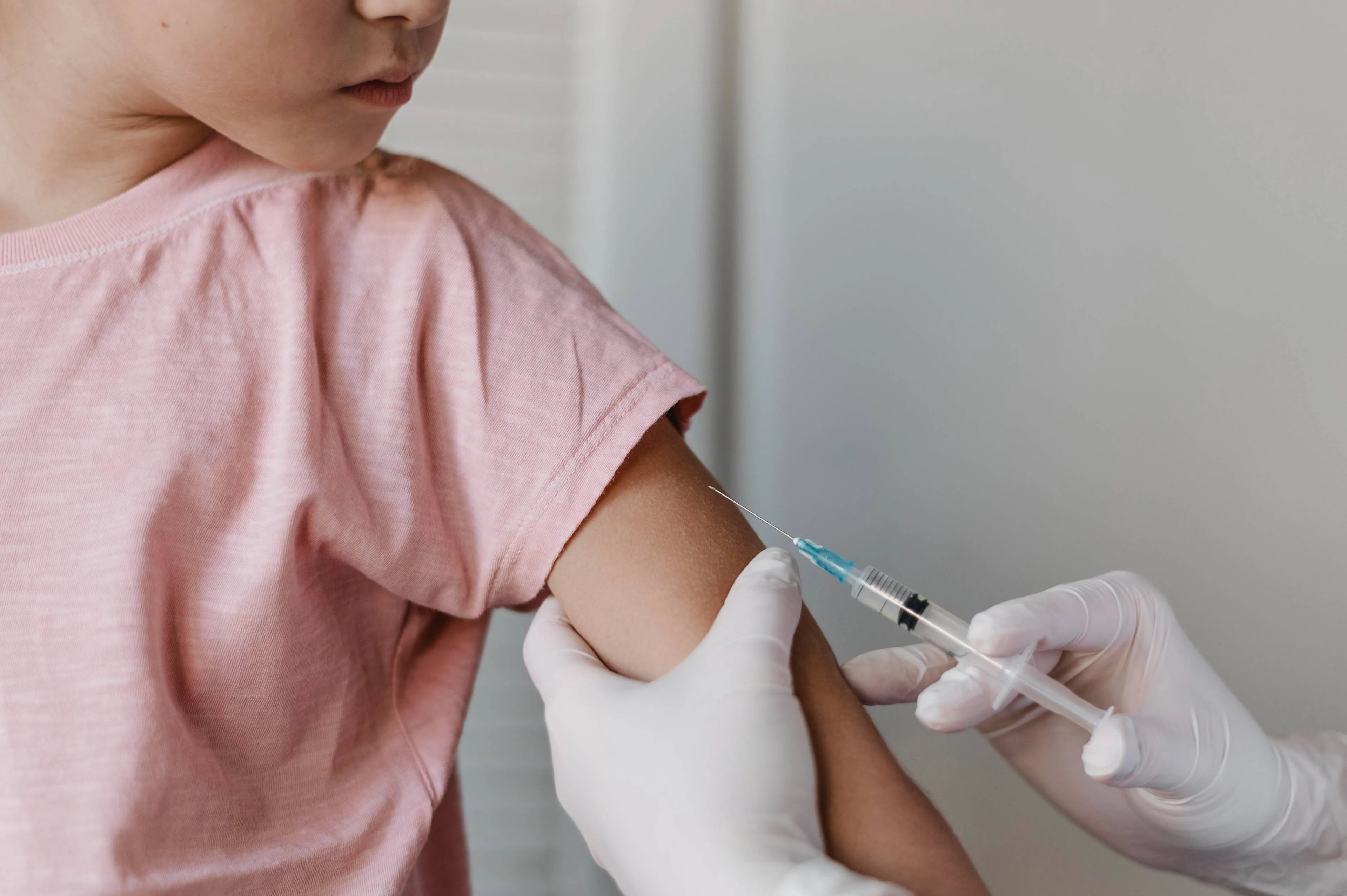 doctor-administering-vaccine-kid