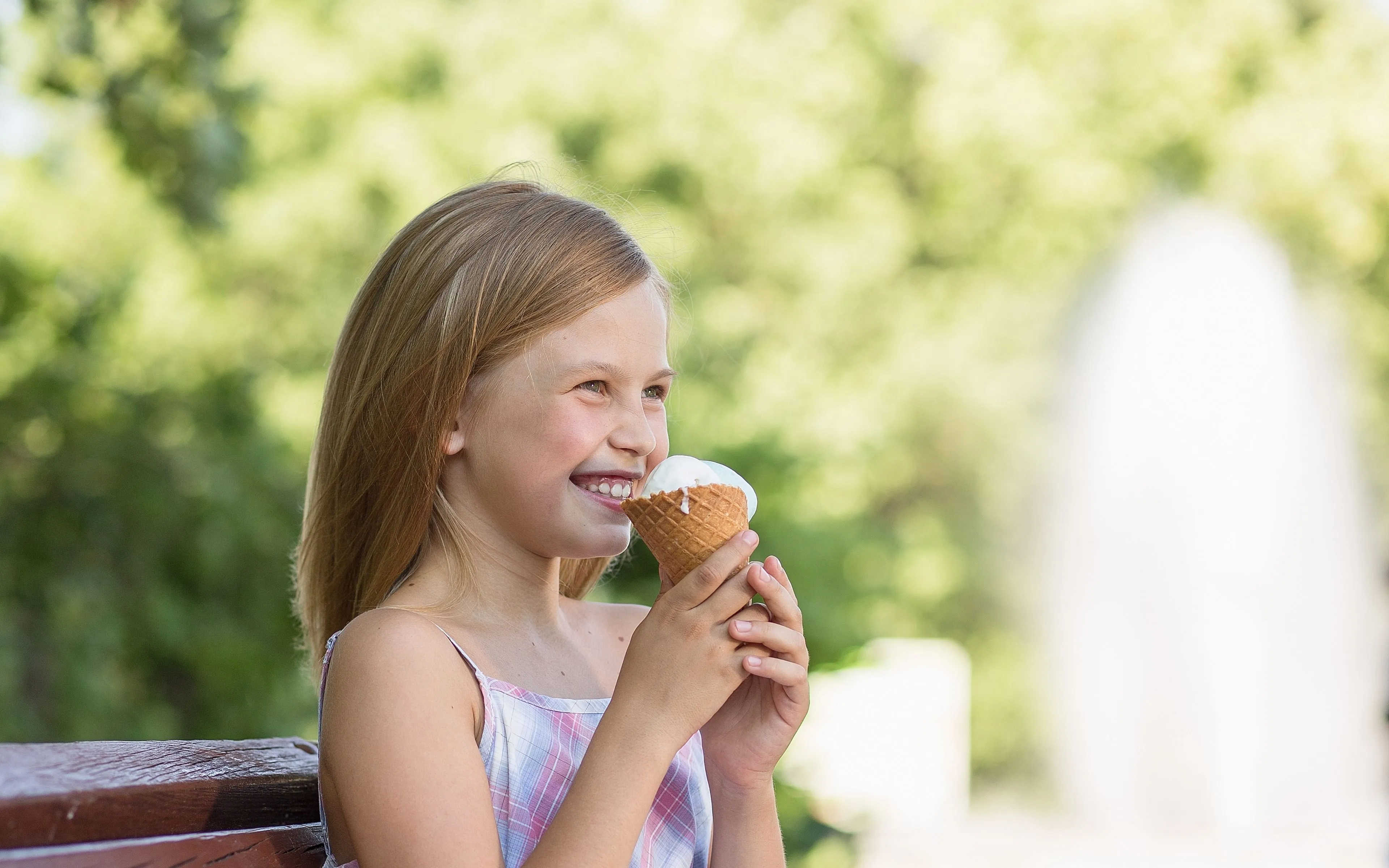 little girl smiling holding ice cream