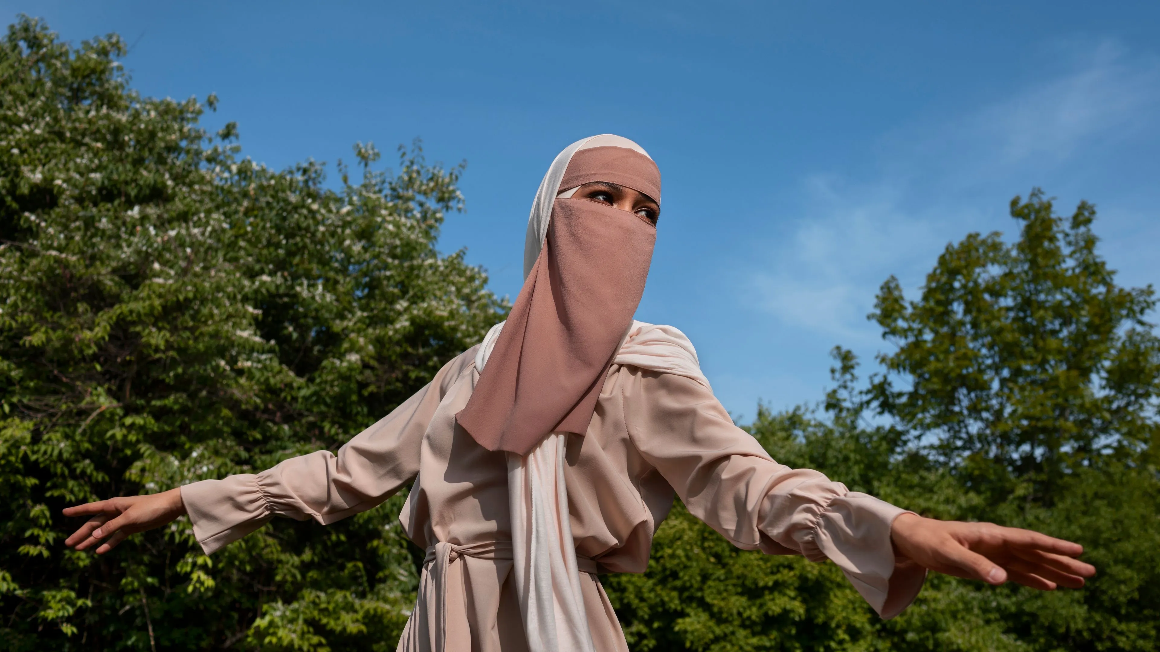 front view muslim woman posing outdoors