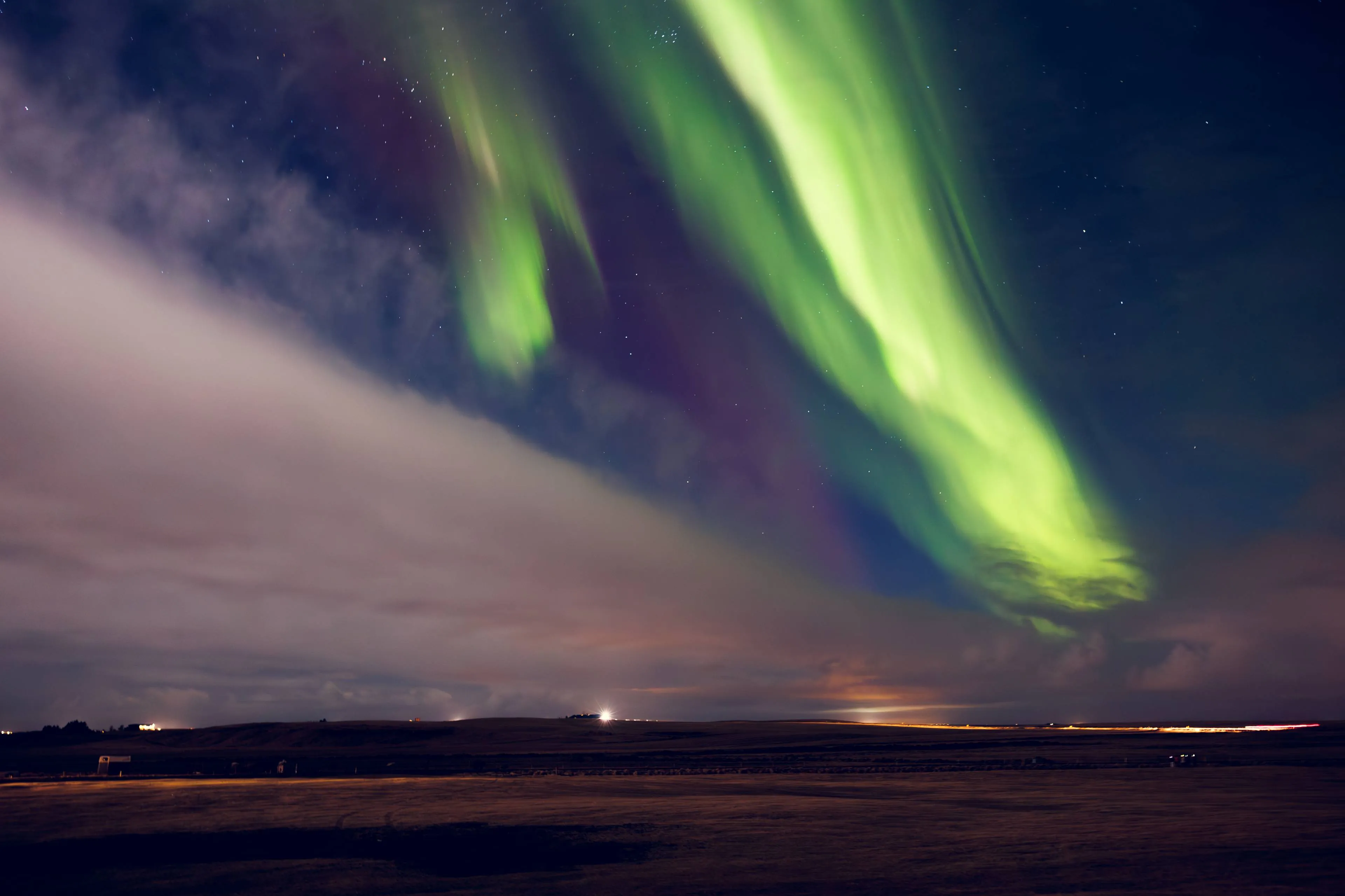 beautiful aurora borealis sky iceland spectacular green violet northern lights appearing night creating panoramic landscape glowing magical natural phenomenon starry sky