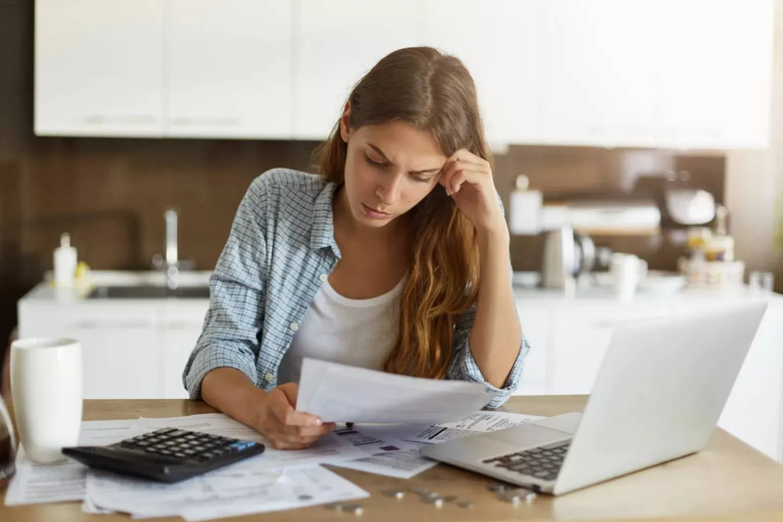 young-woman-checking-her-budget-doing-taxes-1-1536x1024